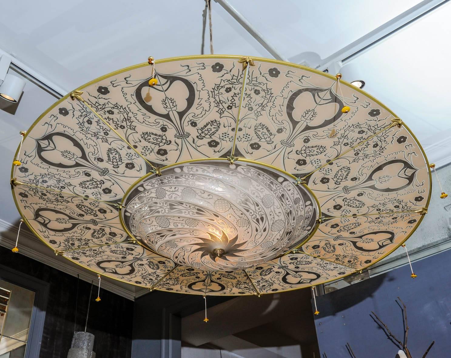 Bohemian style with Art Nouveau design. Murano glass and suspended by a delicate net of cords.