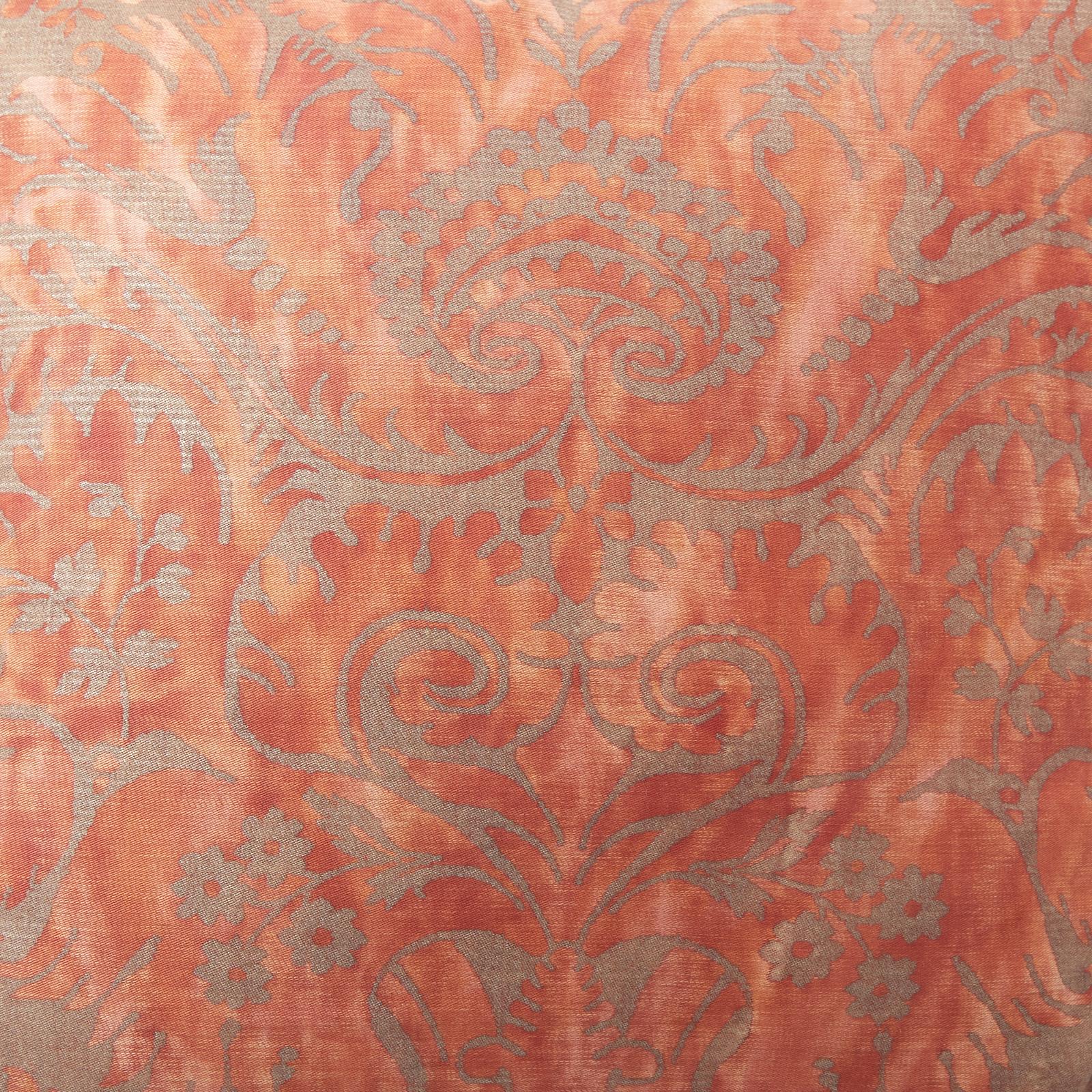 A vintage, square shaped Fortuny fabric cushion featuring a unique brush fringe. The pattern showcases a dark silver and rose colorway. All our Fortuny cushions use vintage fabric with otherwise new materials, and feature 50 down/50 feather inserts.