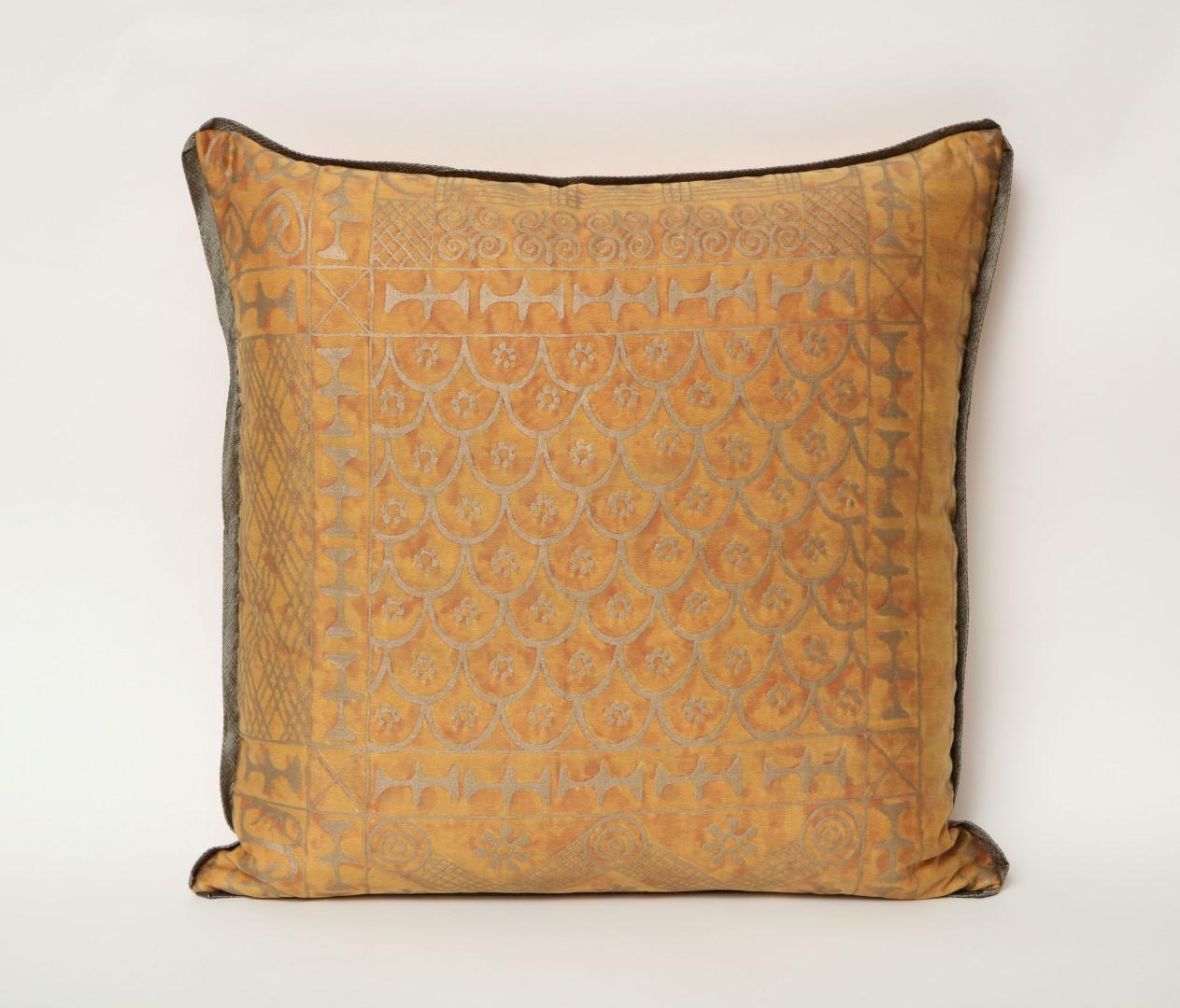 A pair of vintage Fortuny fabric cushions in the Ashanti pattern, burnt apricot and silvery gold color way with braided edging and silk blend backing, the pattern, a Geometric design with African tribal motif.
50 down/50 feather insert.
Vintage