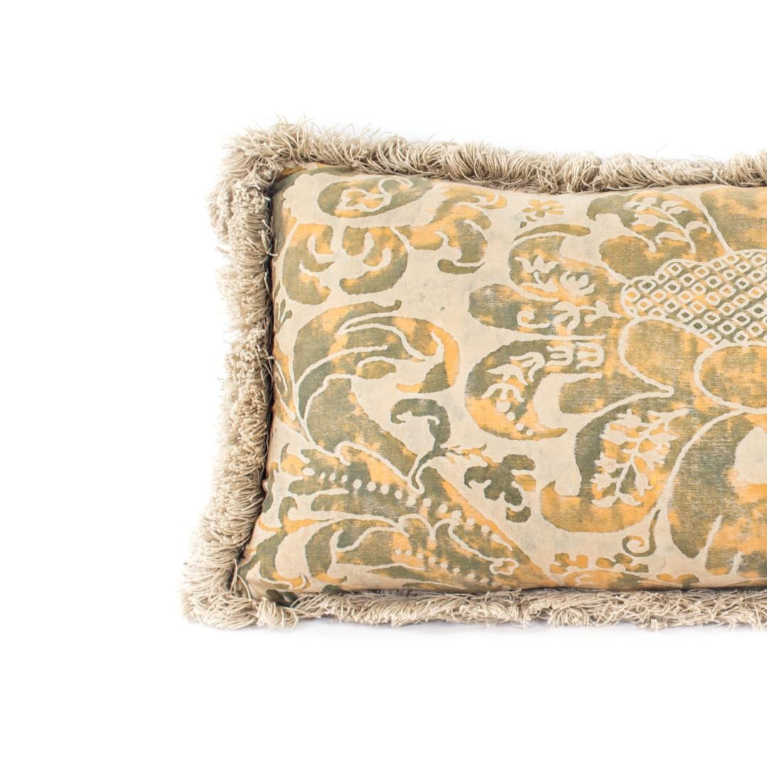 A lumbar pillow made with antique Fortuny fabric in natural shades. Features beige fringe and feather/down fill.

Measures: 26 inches L x 12 inches H.