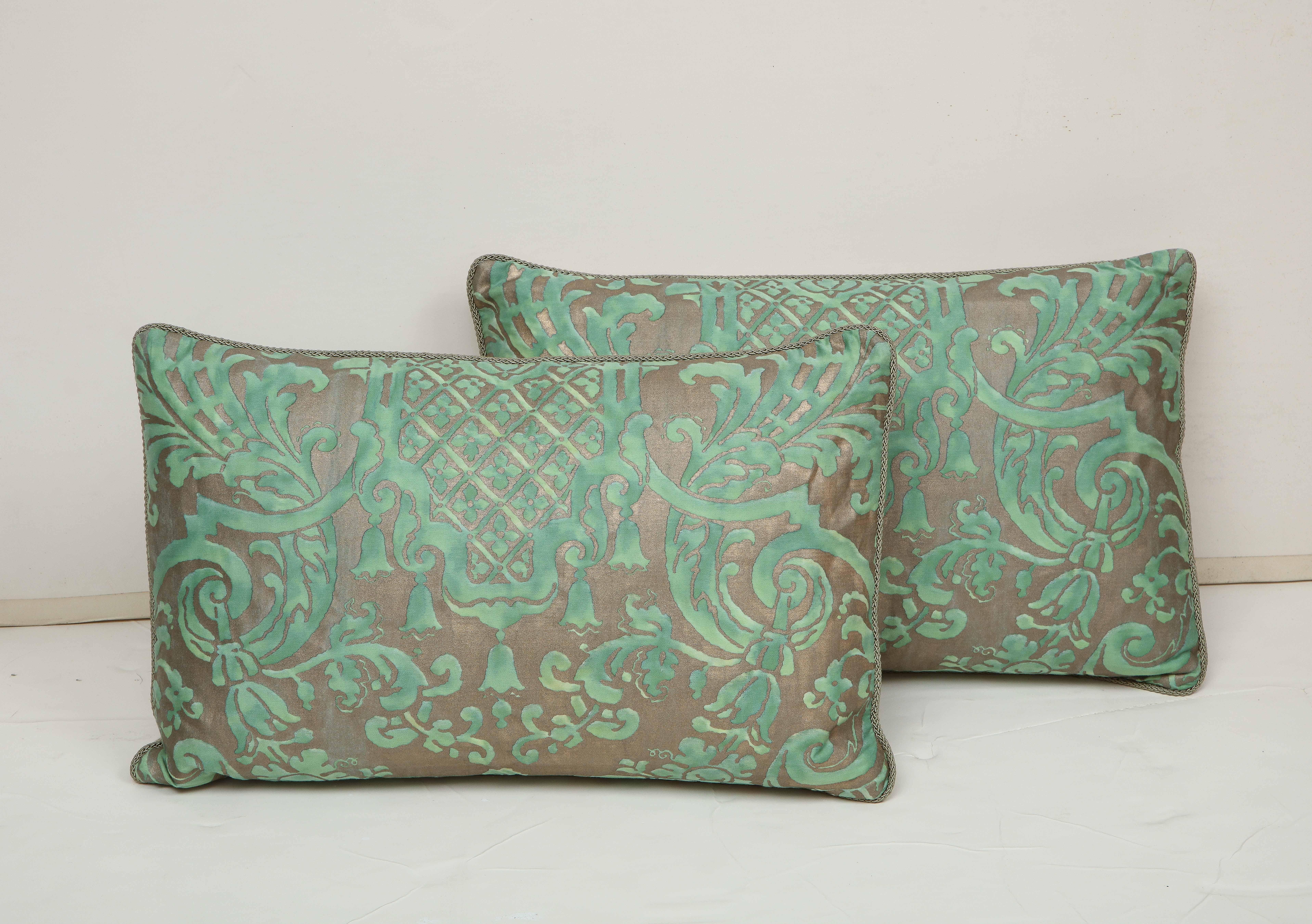 A pair of pillows in a green and grey Fortuny silk backed in a natural linen. Priced separately at $475 each.