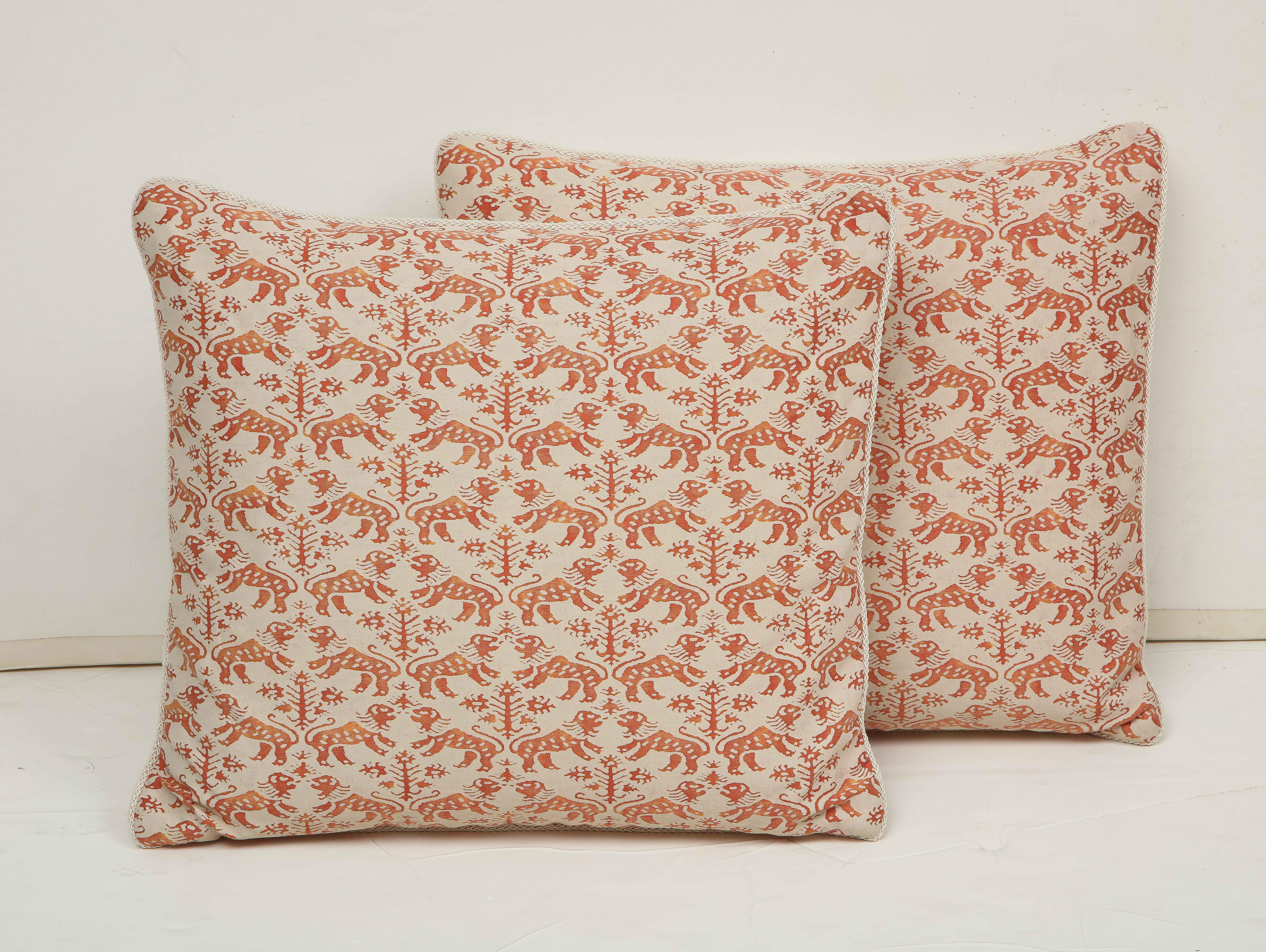 Pair of pillows covered in orange and cream Fortuny silk and backed in natural linen. Individually priced at $475.