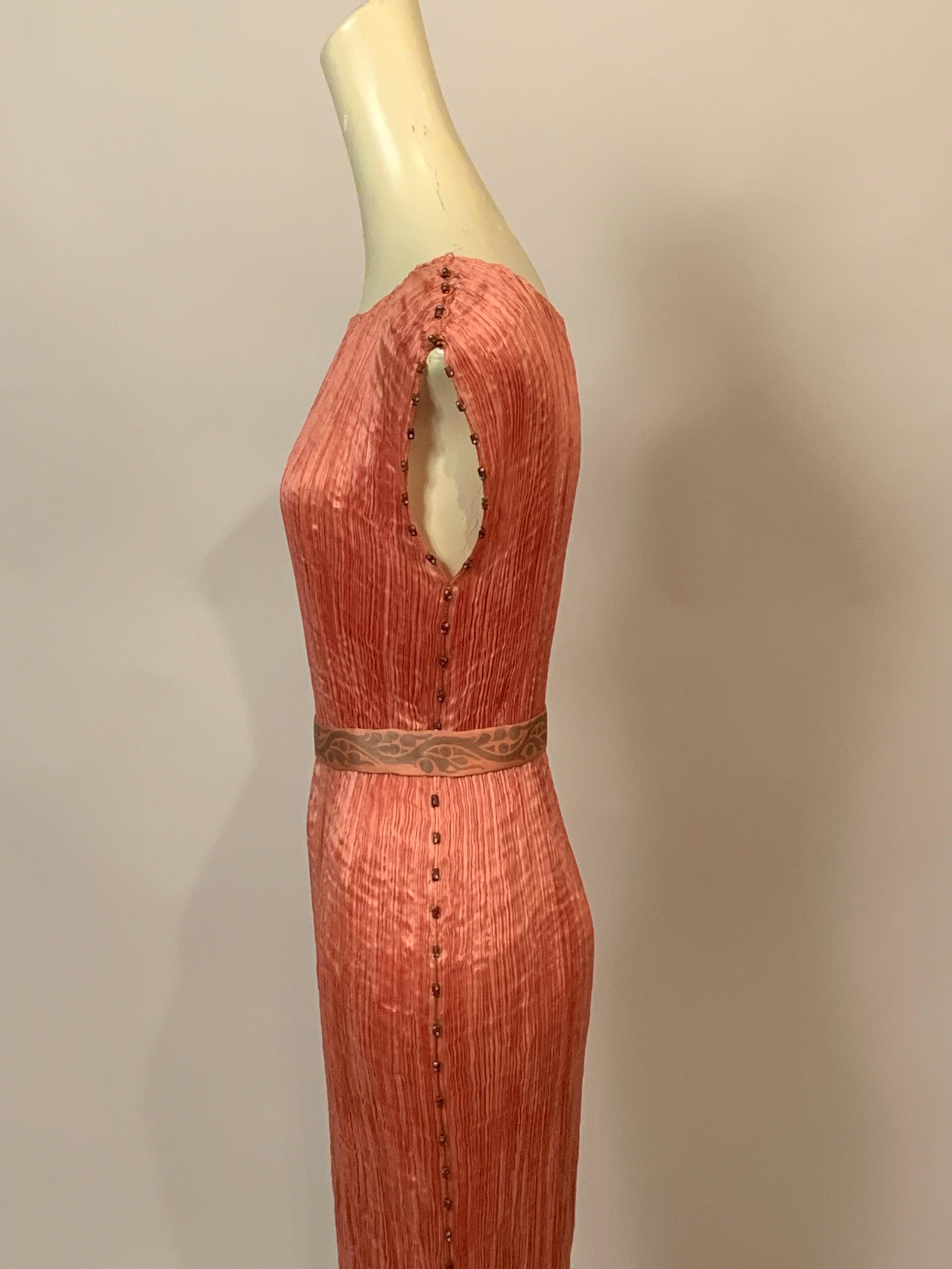 A Fortuny Delphos with the original belt is an exceedingly rare vintage couture find. This example is in very good condition and it is a very wearable dress. The pleats are tight, all of the Venetian glass beads are in place, the belt is crisp and