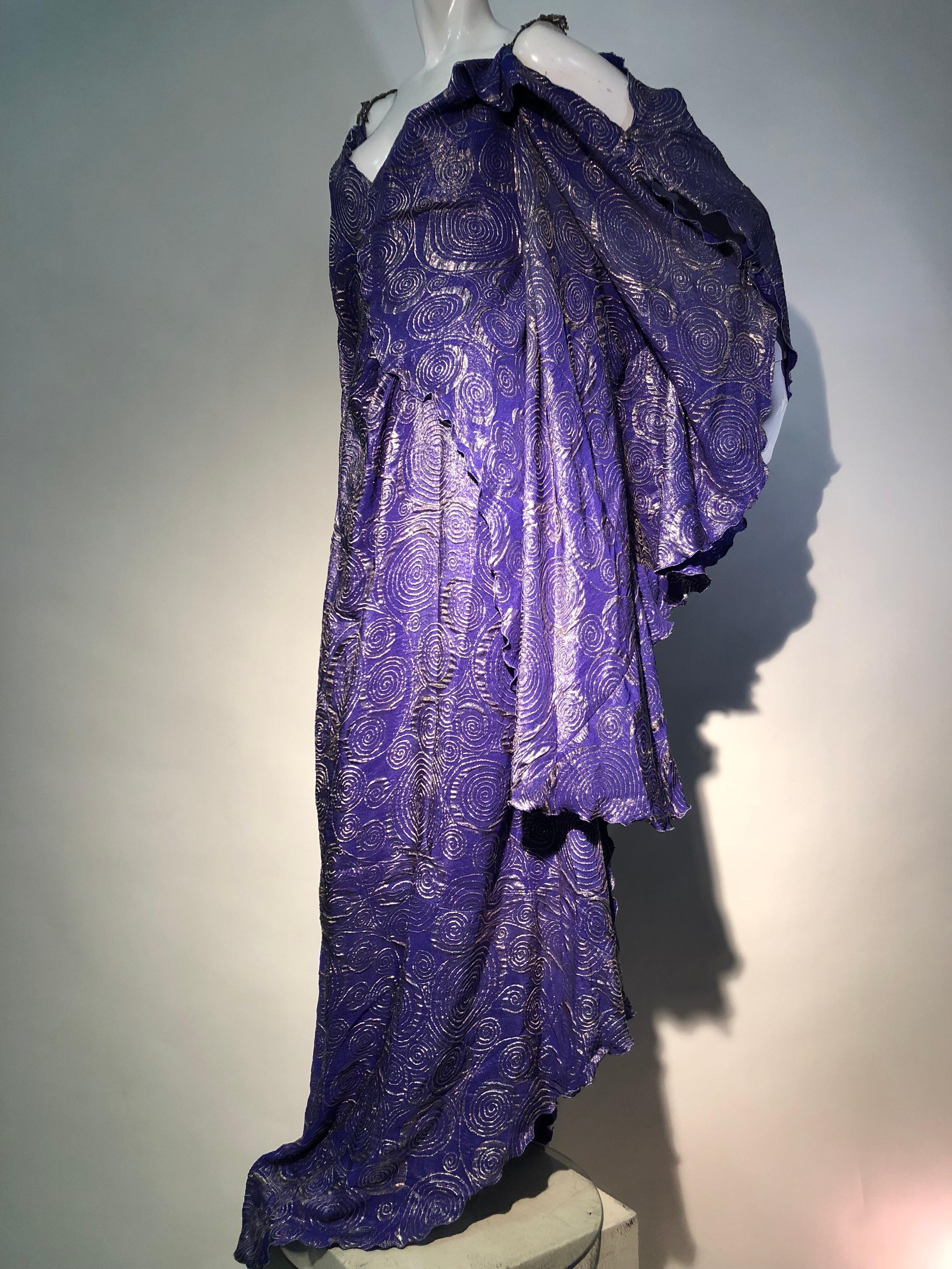 A Torso Creations 1930s-inspired, Fortuny-style violet and silver lamé swirl patterned wrap caftan with antique rhinestone shoulder straps. Fabric is original 1930s silk came from Lèon, France. Draped shoulders and open slits in arms. Lettuce styled