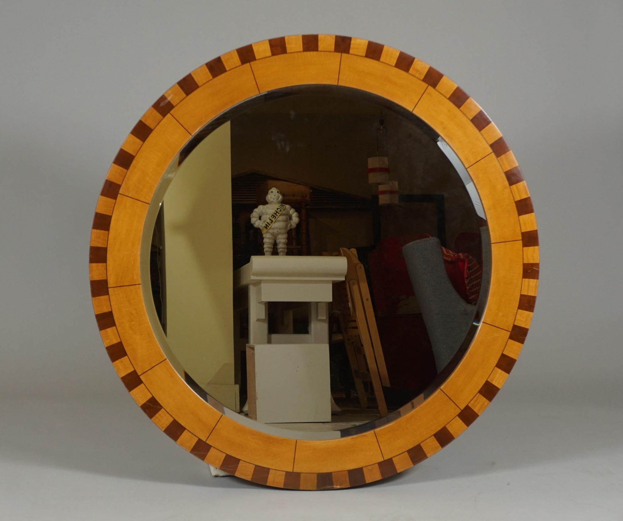 Stunning, large inlaid framed mirror. Diameter 42 inches.