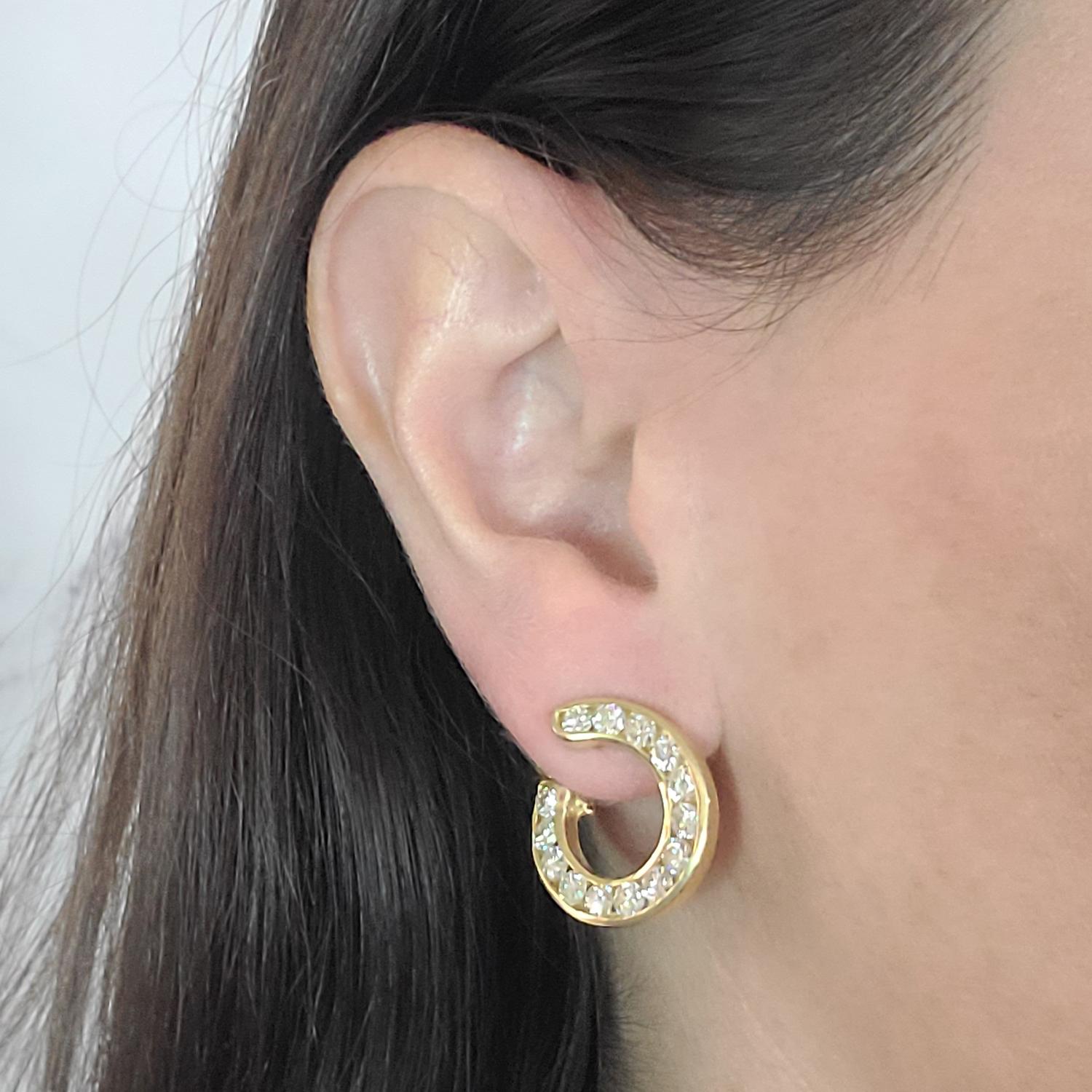 18 Karat Yellow Gold Forward Facing Circle Swirl Earrings Featuring 28 Channel Set Round Brilliant Cut Diamonds of VS Clarity and H Color Totaling Approximately 3.00 Carats. Front to Back Design with Pierced Post with Supportive Omega Clip Back;