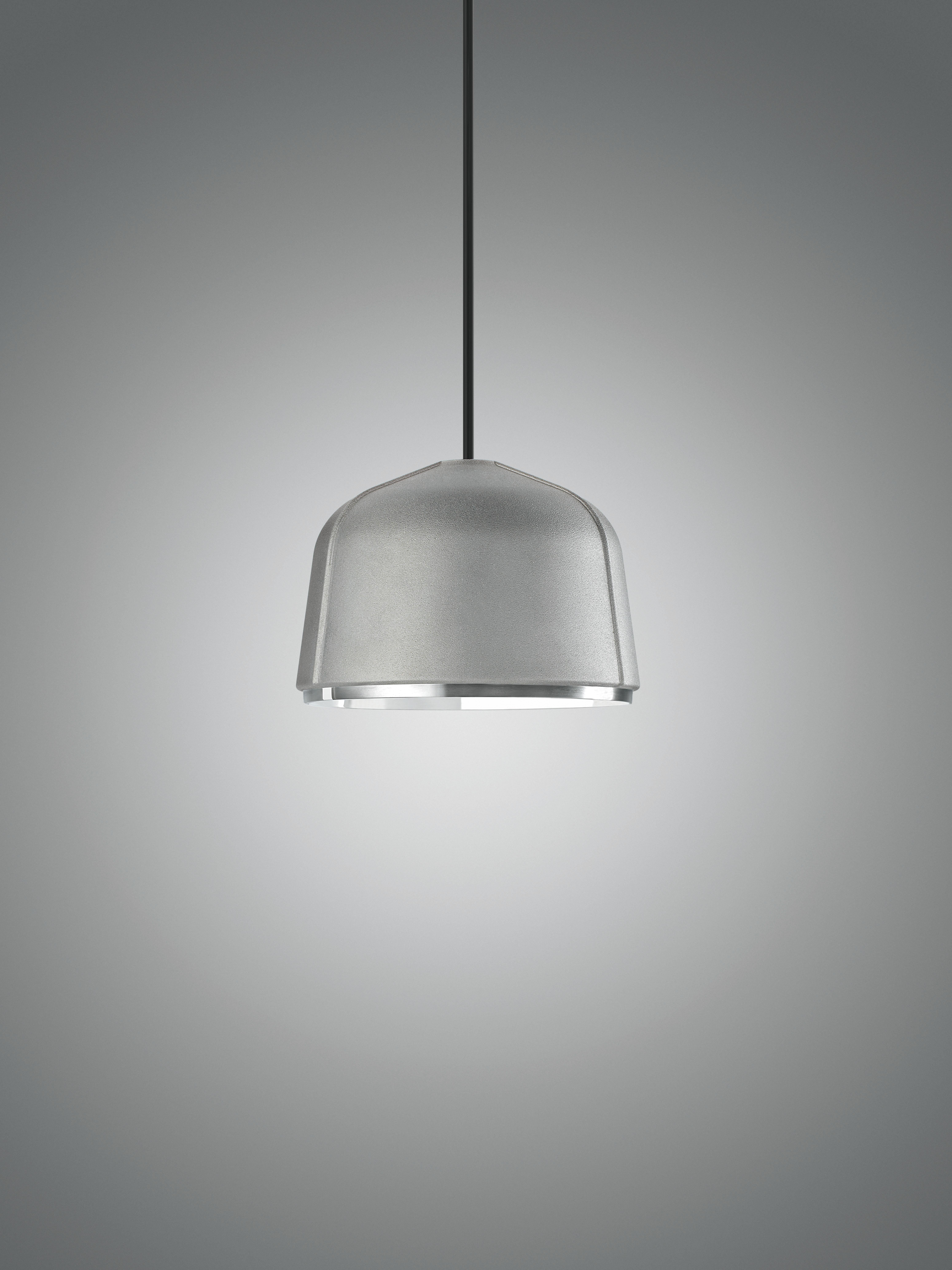Suspension lamp with direct down light and built-in Acrich dimmable Triac LED. The die cast aluminium dome is processed on the outside by manual sanding to create the matt effect aluminium, while the inside is hand-polished and liquid coated with