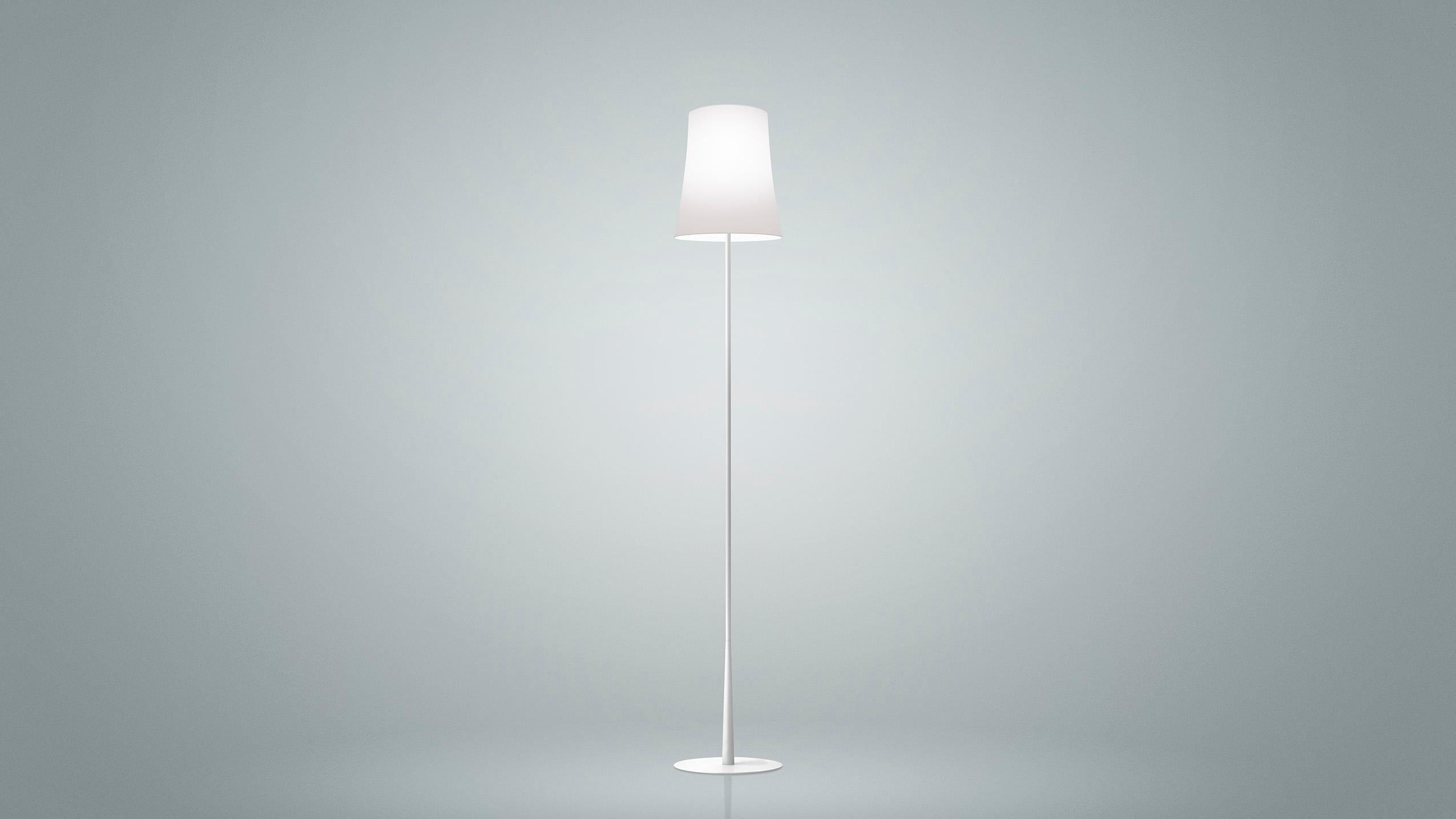 Floor and reading lamp with diffused light. Die cast zinc alloy base and steel rod, both liquid coated. Opaline polycarbonate internal diffuser, translucent polycarbonate external diffuser, both injection molded. The touch dimmer sensor is located