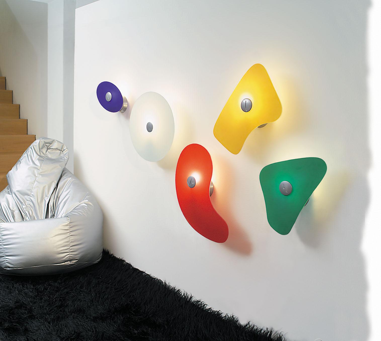 Wall lamp with reflected and diffused light. Wall fitting and wall rose in epoxy powder coated metal. Satin finish white or color painted glass diffuser, available in 5 different shaped and colored shapes, secured to the wall fitting using an epoxy