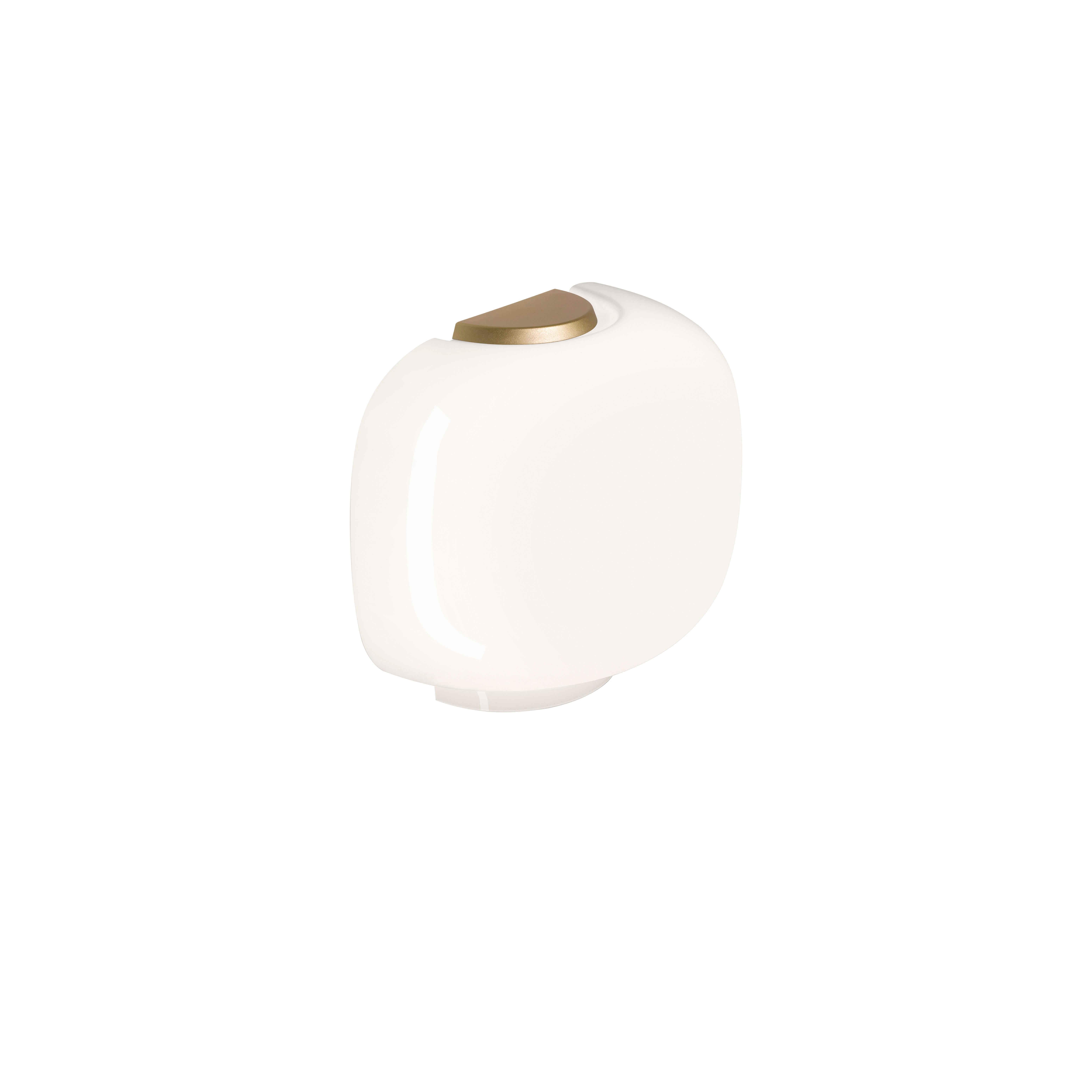 A personal, discreet form in shiny blown glass, for a glare-free, warm and gentle glow.

Materials:
Lacquered blow glass.

Light Source:
Max 1x30W E26

Color:
White, Gold, Graphite

Light Bulbs not included
