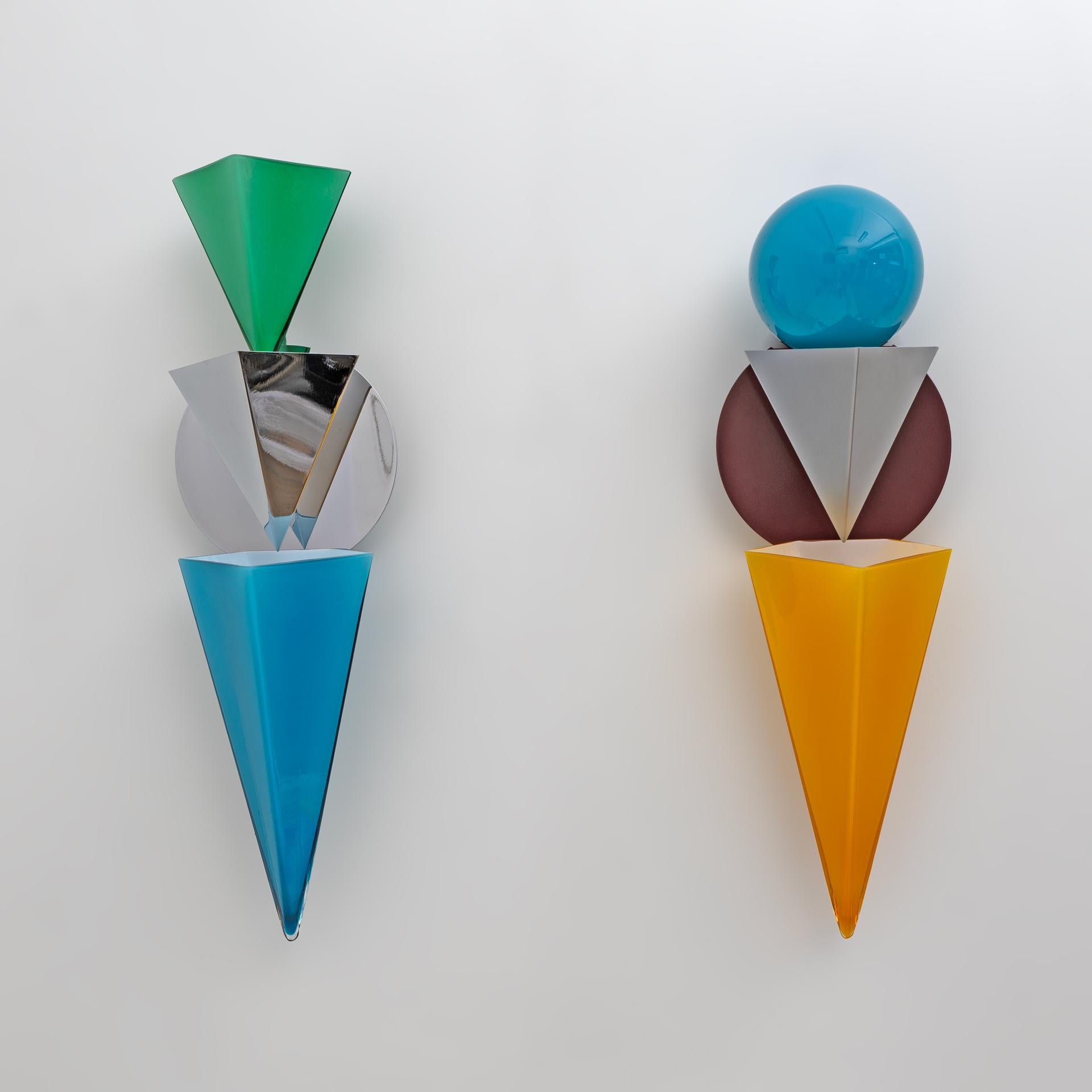 Rare wall lamps by Foscarini. Stunning geometric design with mouth-blown and primary colored laminated glass. Two halogen bulbs. Designed by Adam T. Tihani and Joseph Mancini.
Price for both lamps.
