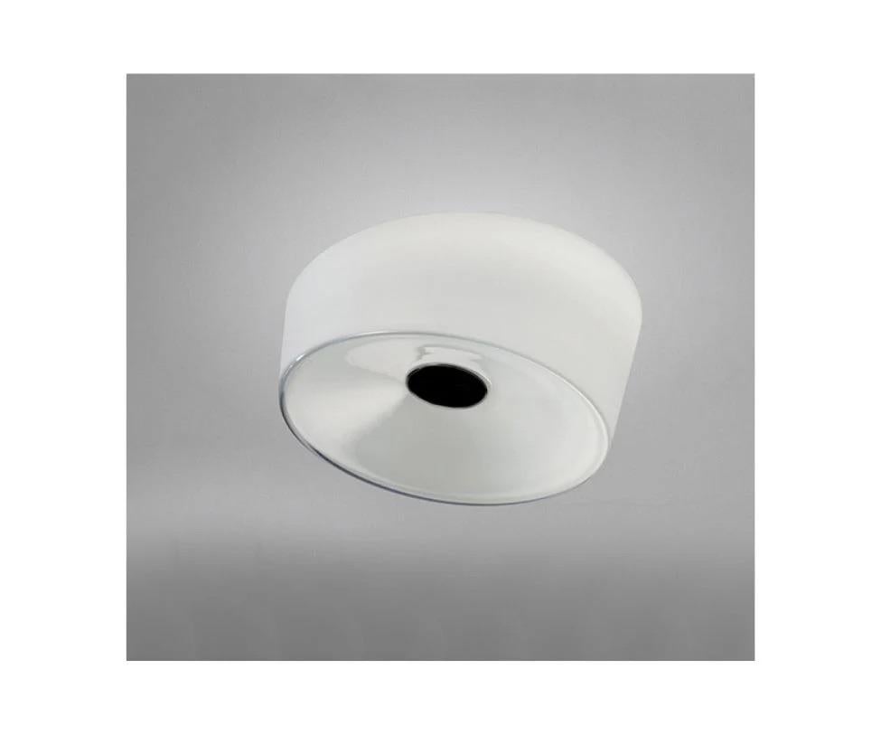 The XXL ceiling lamp stands out for the dynamic oblique cut of the blown glass diffuser: strikingly simple and unprecedented geometric shapes made with the craftsmanship skill of master glass-makers. 

Material: Blown glass and metal or varnished