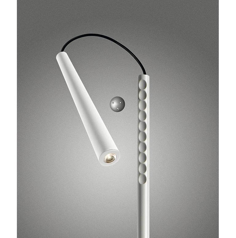Table lamp with direct light. Batch dyed ABS diffuser with incorporated LED, epoxy powder coated steel base and swivel rod. The “super magnet”, spherical in shape and made of “rare earth” co-molded with a thermoplastic elastomer, acts as a joint and
