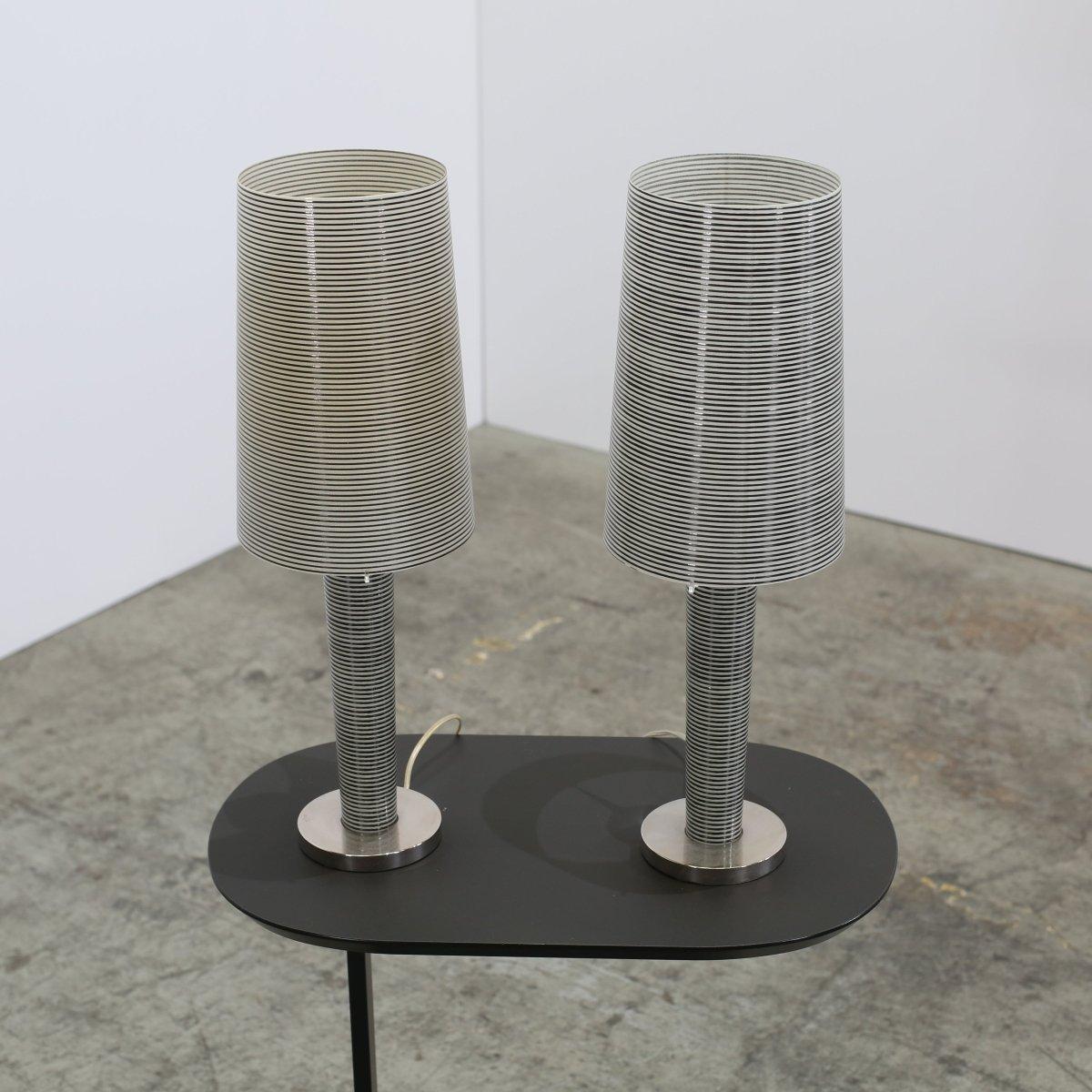 These two Foscarini Murano Tavolo Grande Table Lamps, designed by the celebrated Marc Sadler, are a true study in contemporary elegance. Each lamp showcases a stunning Murano glass shade, a testament to traditional Italian craftsmanship, which casts