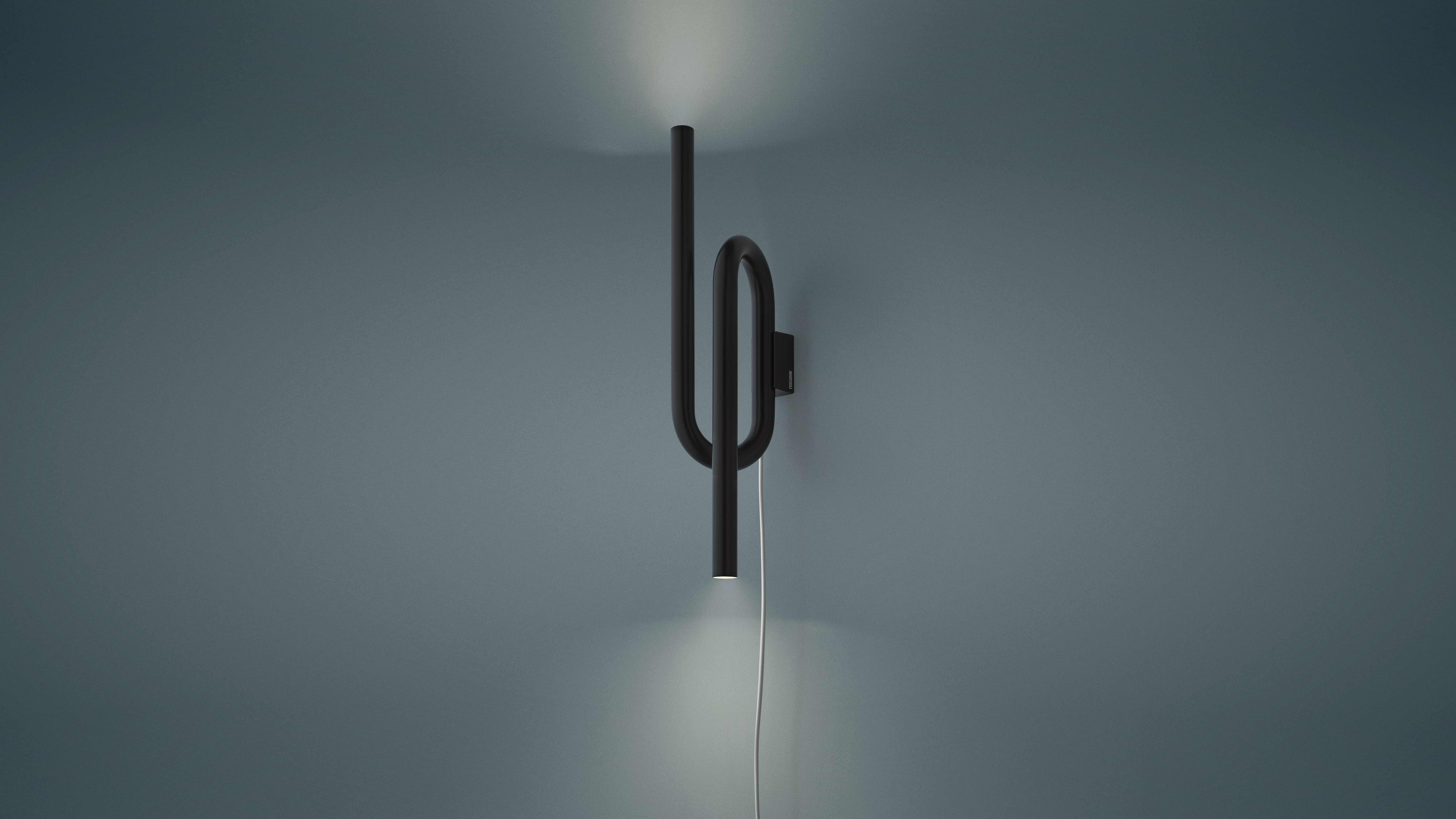 The lightness of a sign that outlines a body and a form to narrate a function. Tobia is an example of how simplicity can have character. Available with and without cable, Tobia wall emits light upwards and downwards.

Materials:
Liquid varnished or