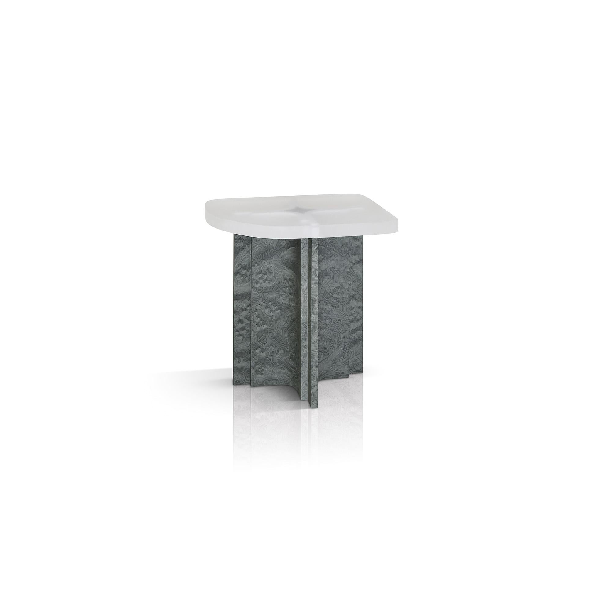 The Fossil tables are inspired by an unusually combination of archaeology and Mies van der Rohe’s columns in the Barcelona Pavillion. As one lounges around the Fossil tables, the supporting structure is exposed through the translucent resin top -