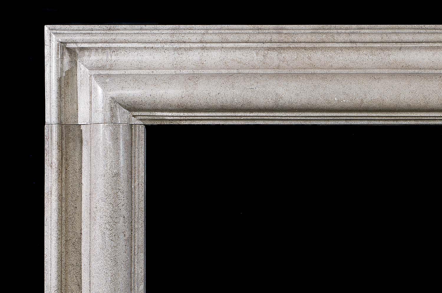 A large, late Victorian Derbyshire Fossil Limestone Bolection fire surround with a polished satin finish. The moulded frieze and jambs raised on substantial and sturdy foot blocks.
English, circa 1900.