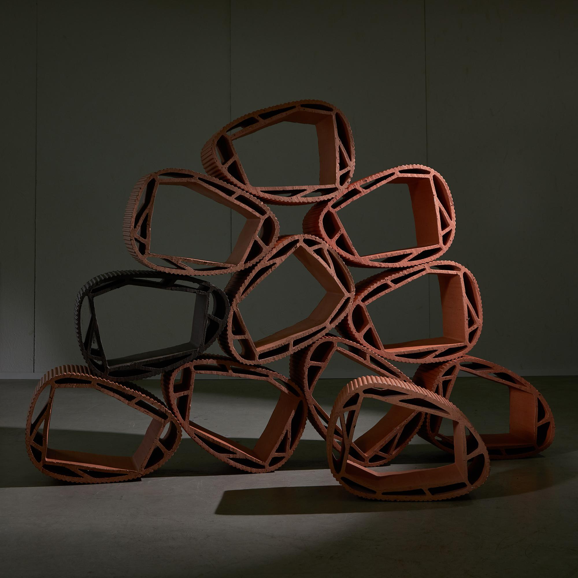 Introducing the Stackable Fired Ceramic Shelf System from Roche Bobois, featuring 11 stunning terra cotta pieces designed by Mostapha El Oulhani, Jerôme Garzon, and Fred Sionis in 2009. This versatile shelving system allows for countless