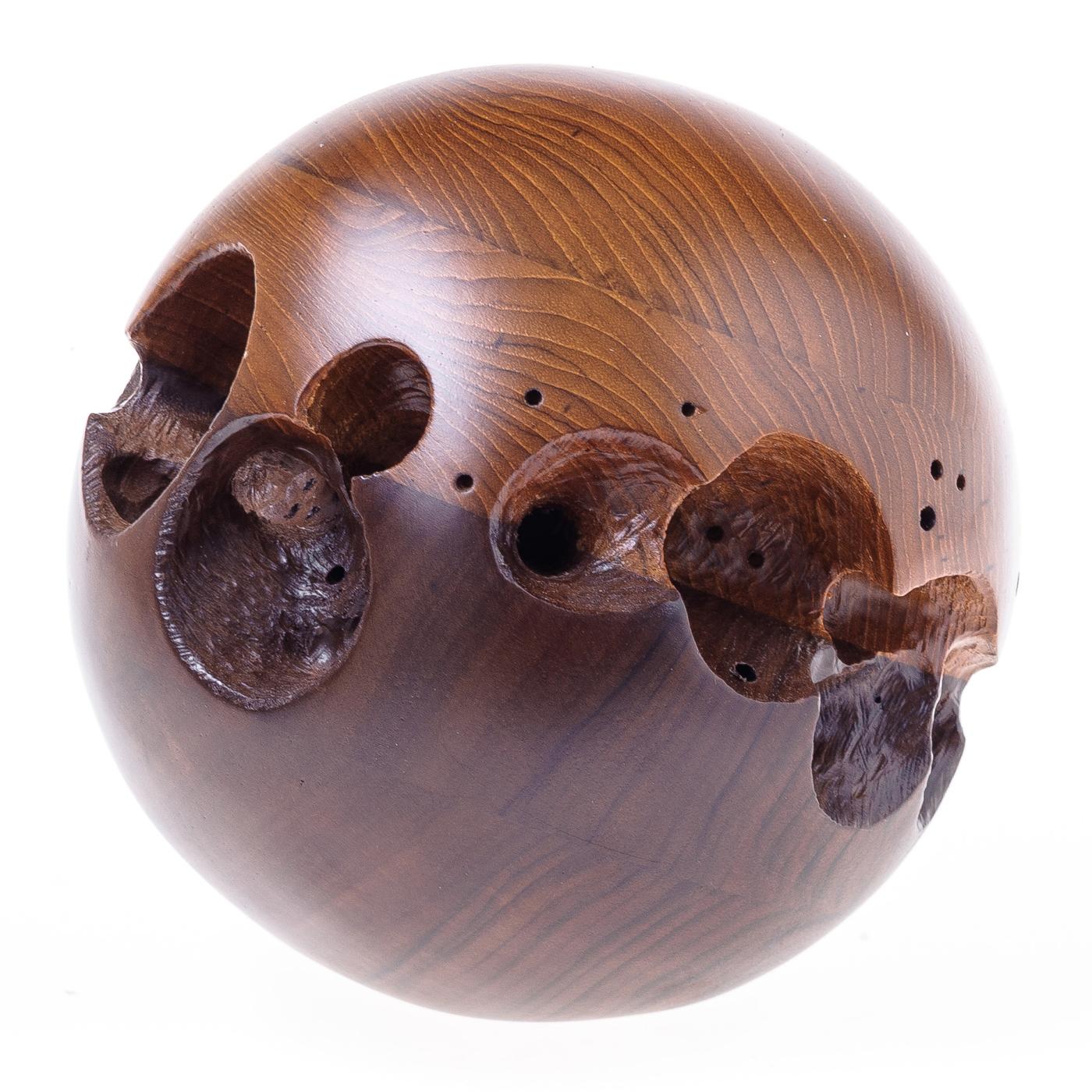 Sophisticated in its simplicity, this wooden sculpture artfully demonstrates superb craftsmanship and Minimalist design aesthetic. This spherical sculpture is handcrafted of teak and Italian walnut, the two halves glued and then manually carved with