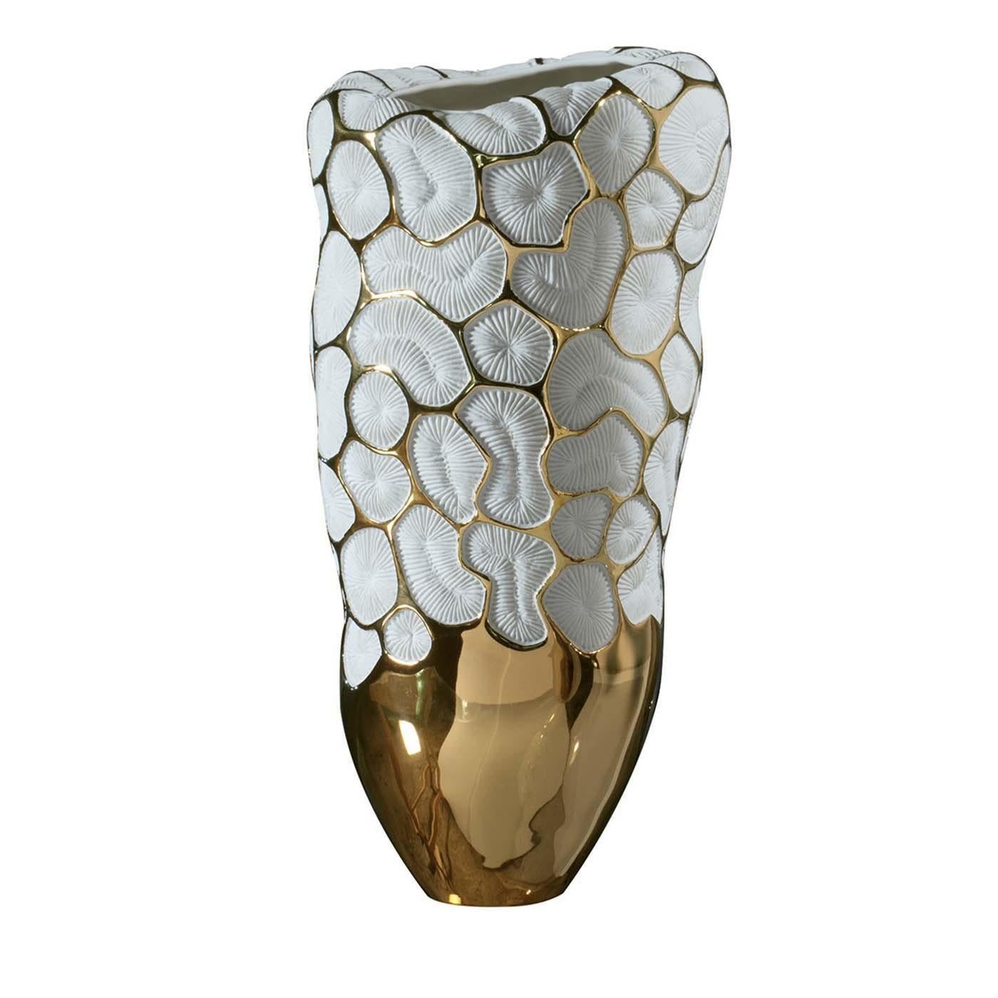 Introduced at Milan Design Week 2019, this superb vase boasts contrasting colors and textures and noble materials for a luxurious effect. It is crafted of unglazed porcelain evident in the minute accents enlivening its body, evocative of madrepore