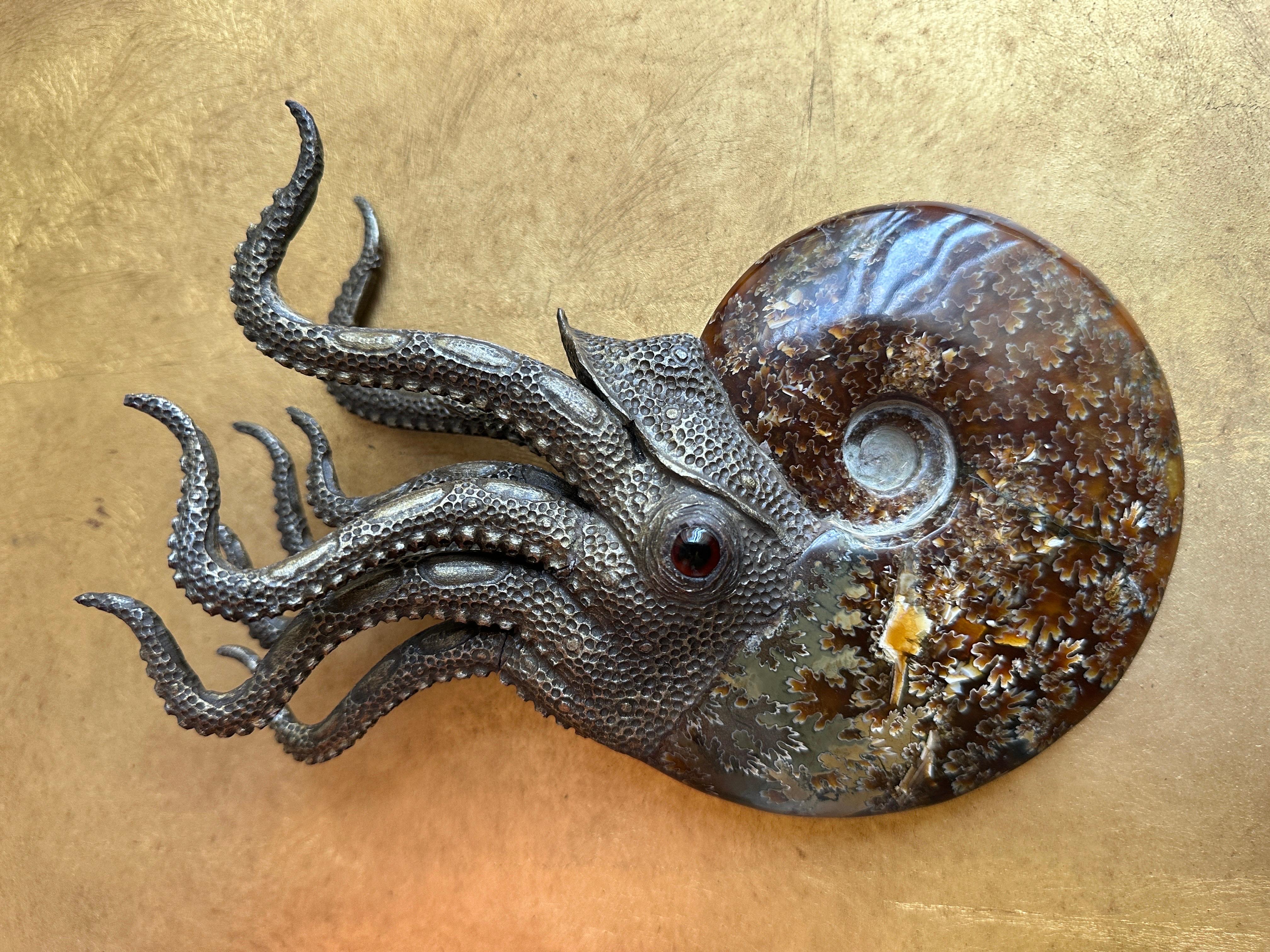 Nautilus sculpture made of prehistoric fossilized ammonite from Morocco 
Tentacles are made of cast composite bronzed material  ( not solid bronze)
Can be used as decorative object or paperweight.