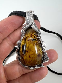 Fossilized Paradise (Amber Pendant) by Ken Fury