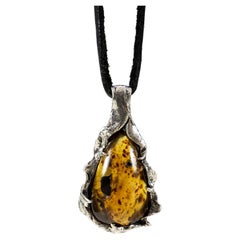 Fossilized Paradise (Amber Pendant) by Ken Fury