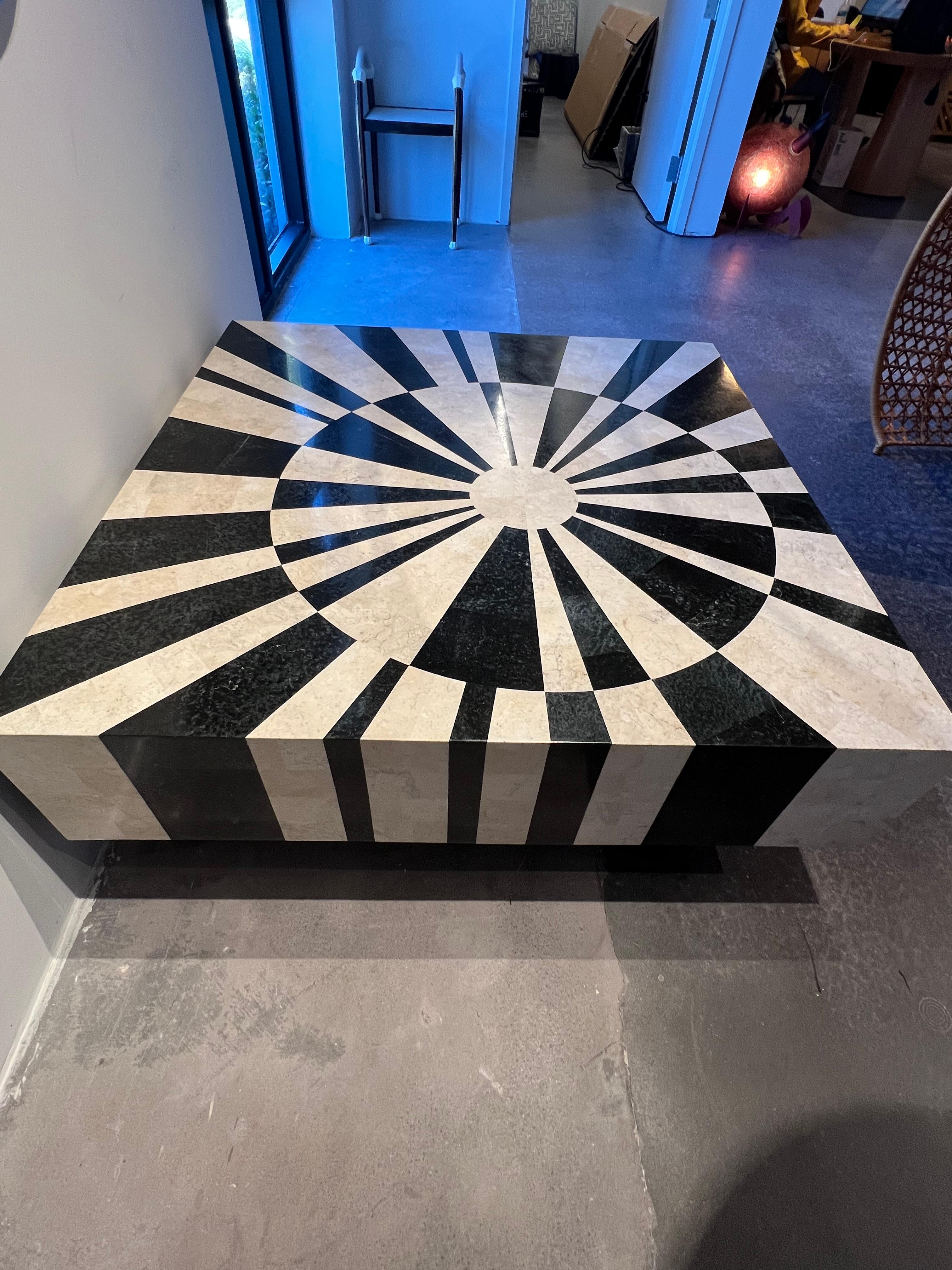 The vibrant pattern of this table is created using Marquetry, the art and craft of applying pieces of veneer to a structure to form decorative patterns, designs or pictures. there are no machines used in the cutting of the stone, this piece is done