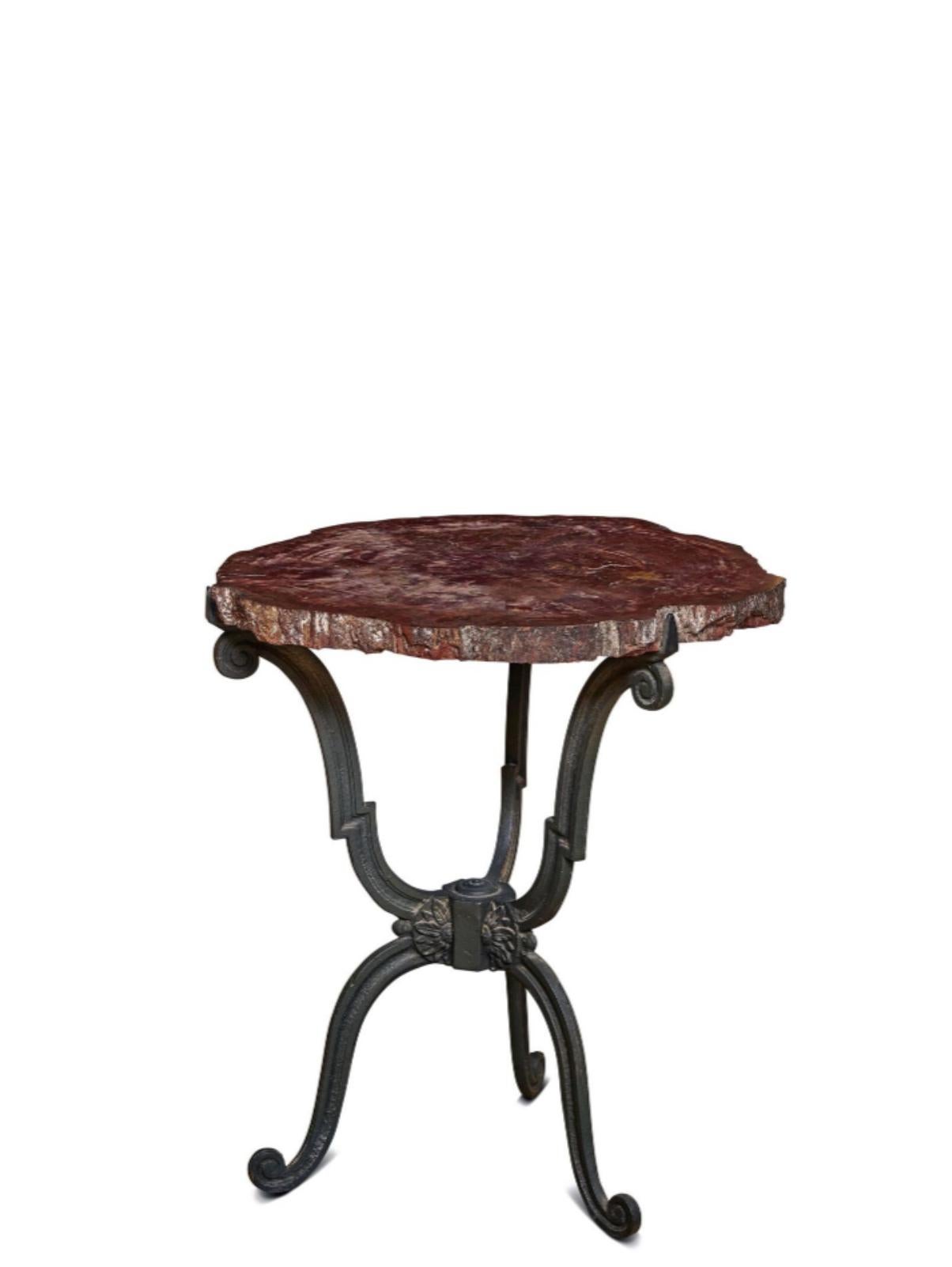 Fossilized Wooden Tray « Araucaria» resting on a cast iron base.

Measures: Height: 70 cm
Diameter: 60 cm.


This beautiful table has a tripod base with patinated cast iron scrolls. Those three feet are joined by their center with a