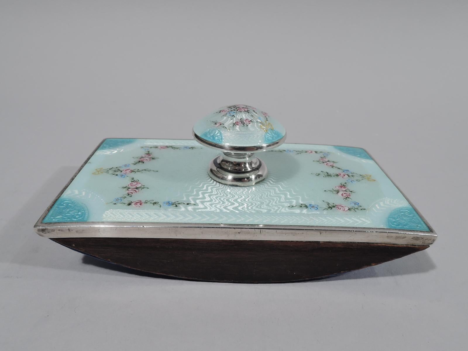 Edwardian Regency sterling silver ink blotter. Made by Foster & Bailey in Providence, circa 1910. Enameled flower garland and basket with gilt bows on whitish concentric waved ground. Sky blue lunettes with leafy scrollwork. A pretty desk accessory.