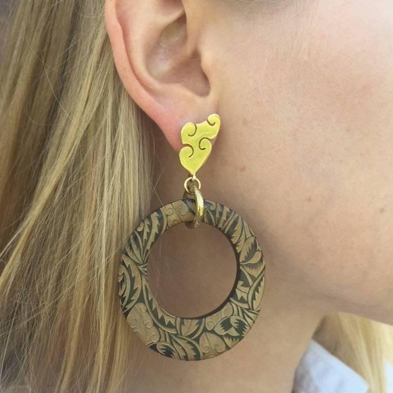 These unique African cow horn are engraved with a wild foliage design. 

Fouché earrings are crafted by artisans in Kenya, East Africa, and finished by hand to the finest quality in London. 

Earrings come pierced with solid silver pin-backs. Please