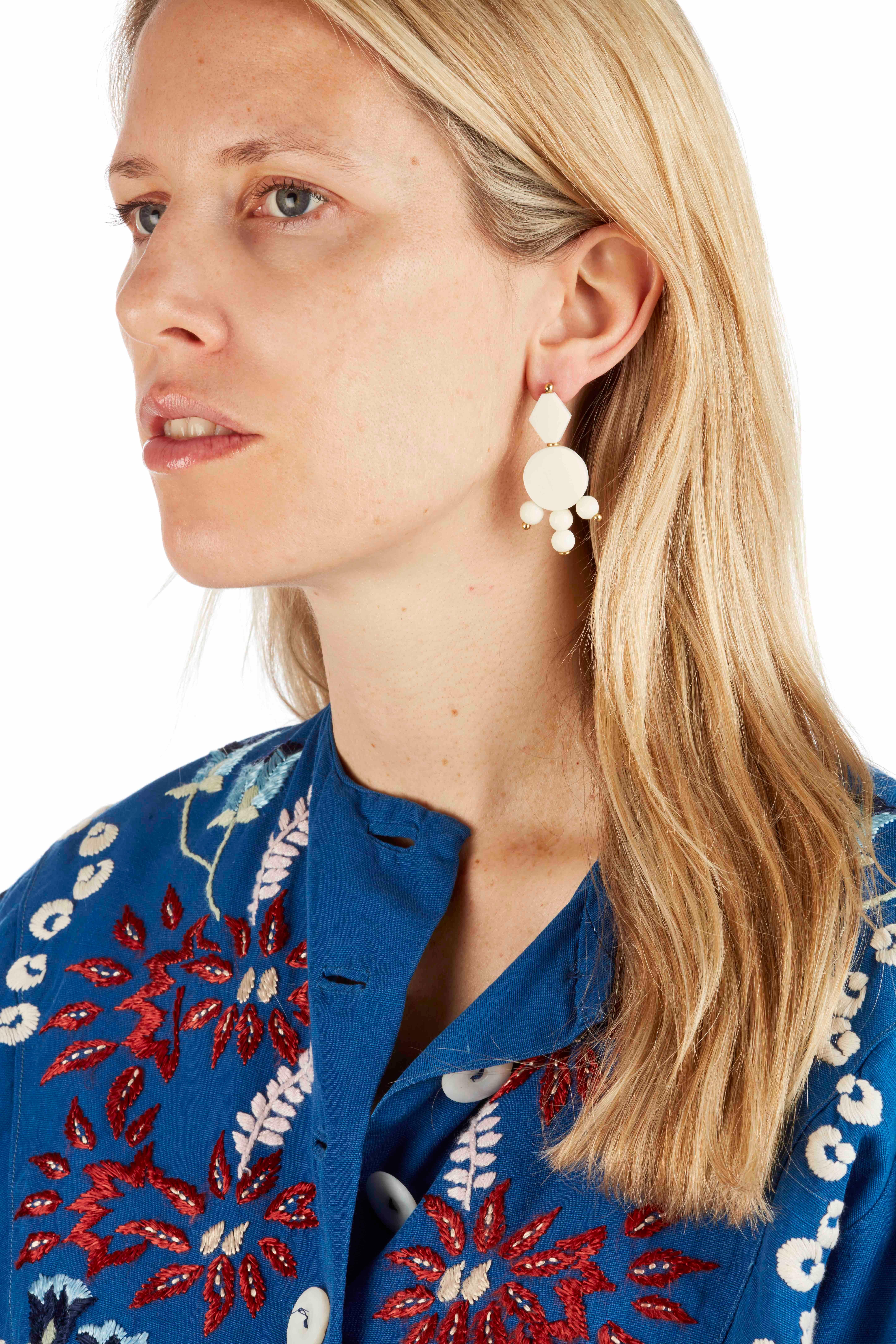The finest carved African camel bone earrings handmade in London with solid silver pin-backs.