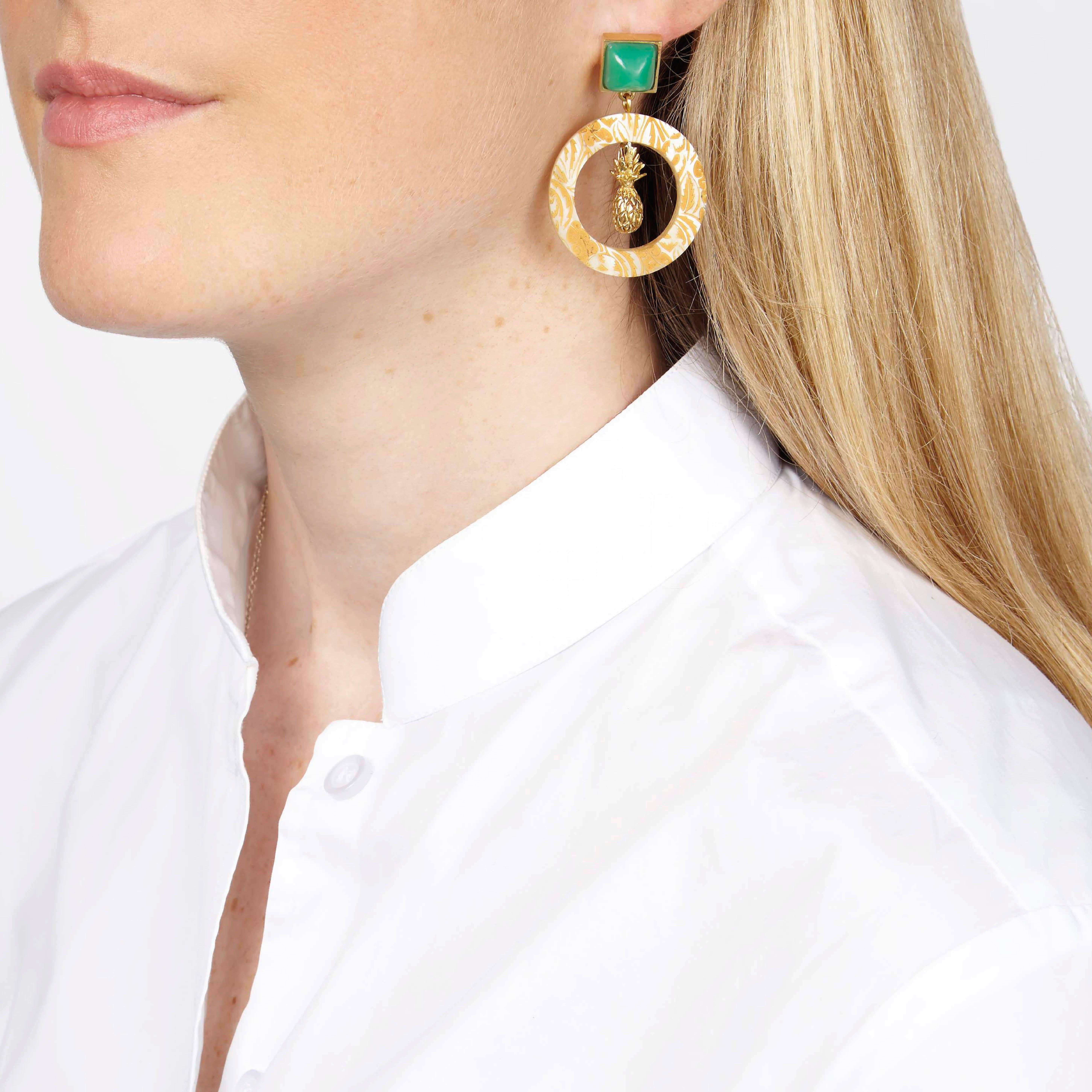 Finely crafted African cow horn earrings set with chrysoprase stones. 

The cow horn hoops are engraved with a floral motif. 

