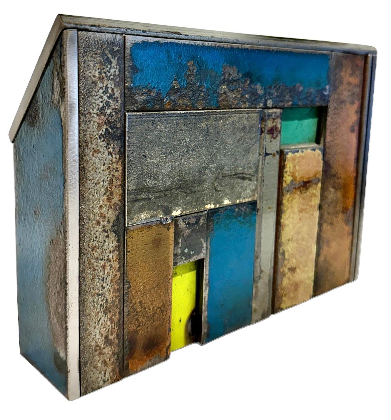 Jim Rose, known primarily for his steel furniture, was an avid collector and scoured salvage yards for unique and interesting items. Here, a collection of found steel is reworked, preserving the original painted surface which has been aged and