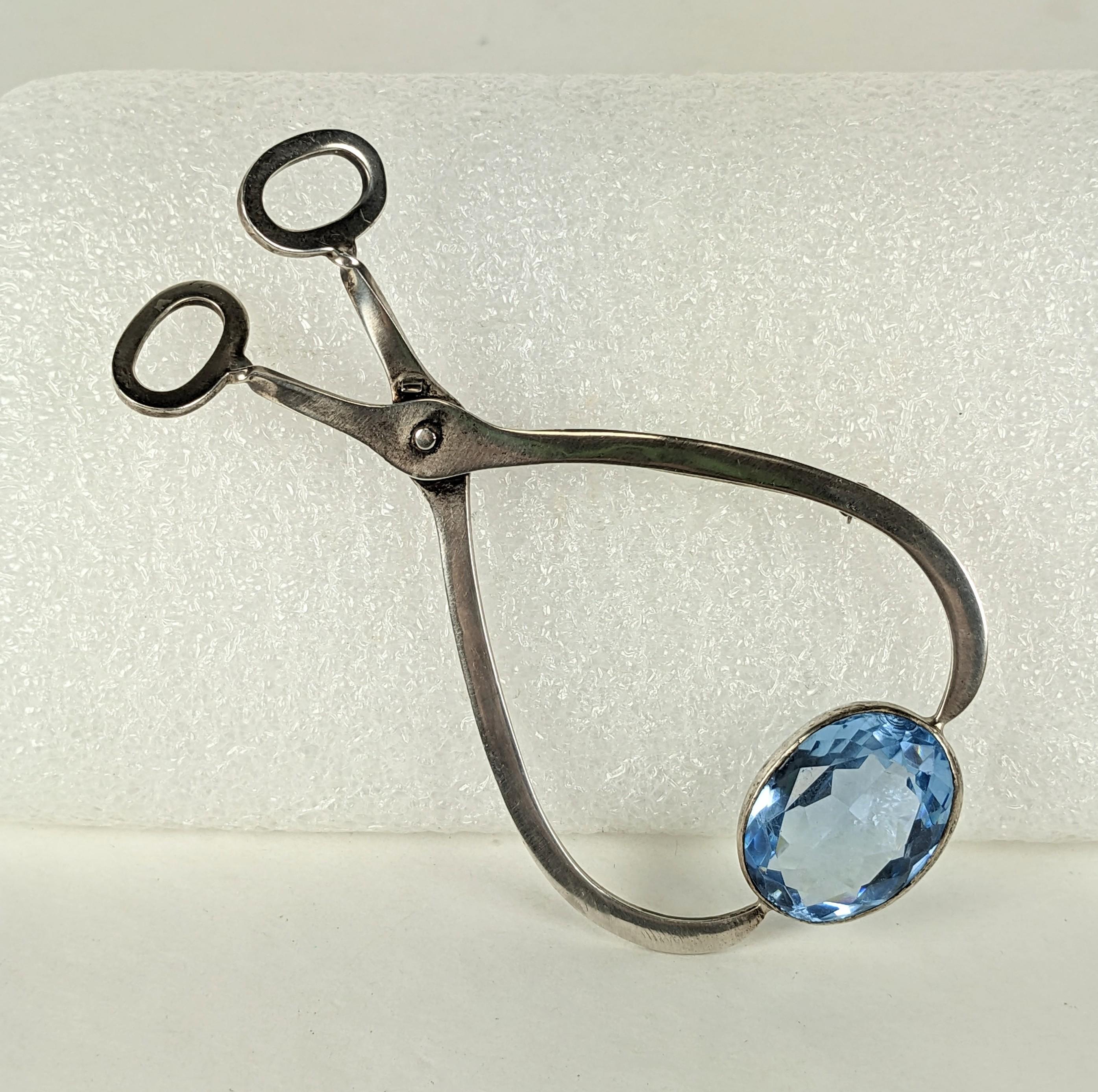 Unusual Found Assemblage Object Brooch by Studio VL from the 1980's. Composed of an antique sterling sugar tong set with a hand bezeled faux aqua stone. 4