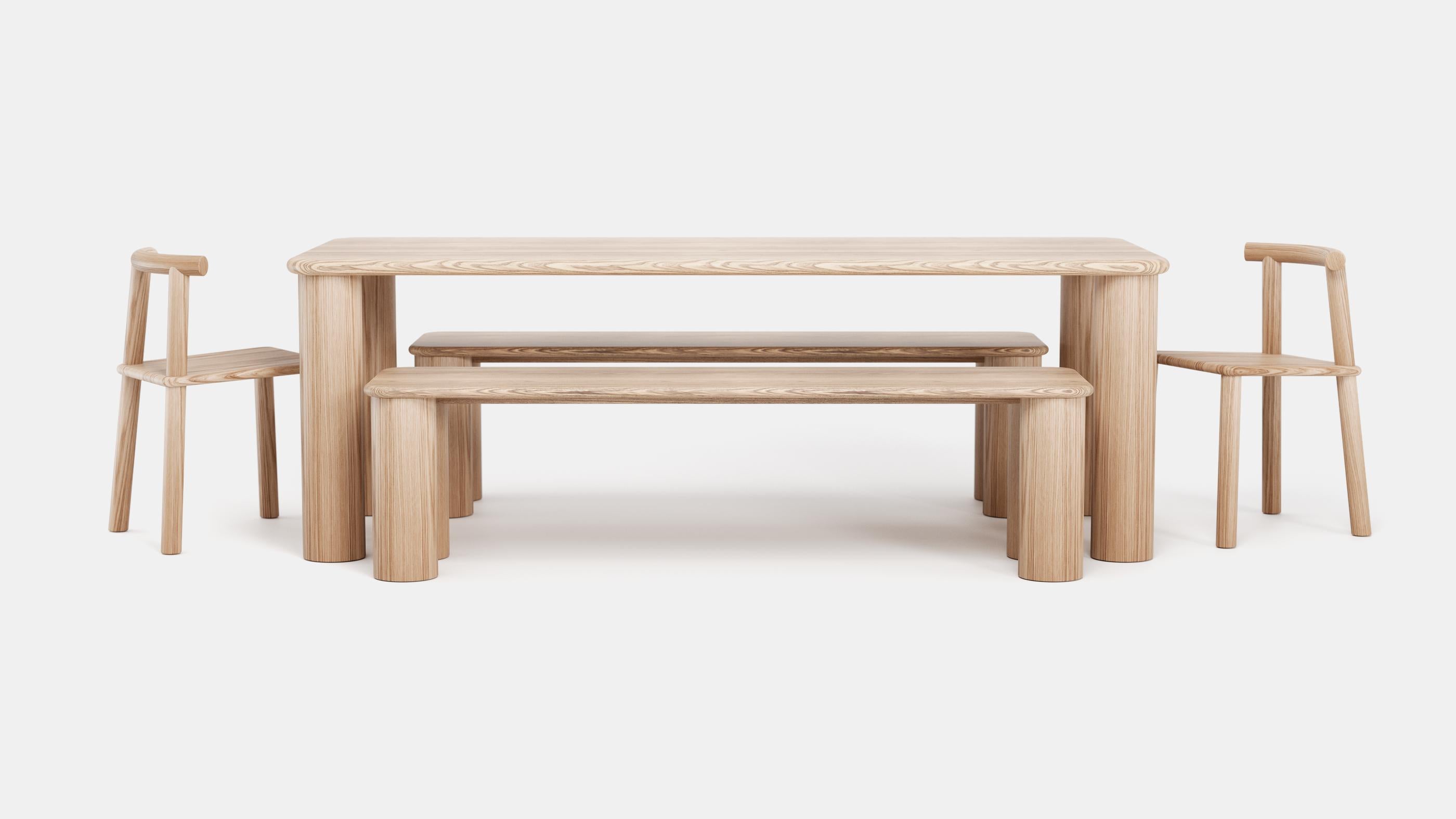 PAUSE is a captivating dining bench that invites you to savor life's moments. Handcrafted from locally sourced red oak, it boasts a clear matte lacquer finish that showcases its natural allure. With its striking interplay of a slender top and