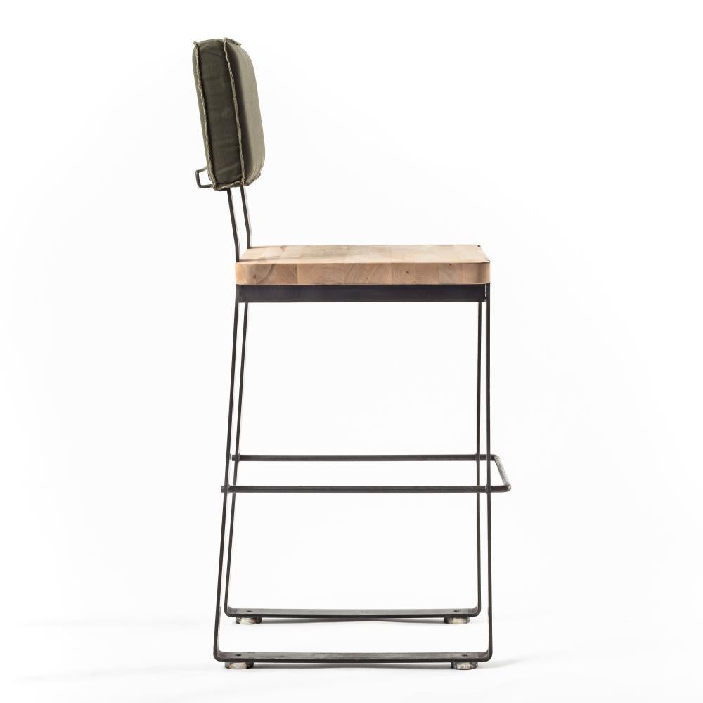 Designed by Basile Built, renowned Design-Fabrication Studio based in San Diego, California, our bar stool merges sleek lines with timeless durability, with its gunmetal-waxed hot rolled steel body, block oak seat, and an easily-cleaned waxed canvas