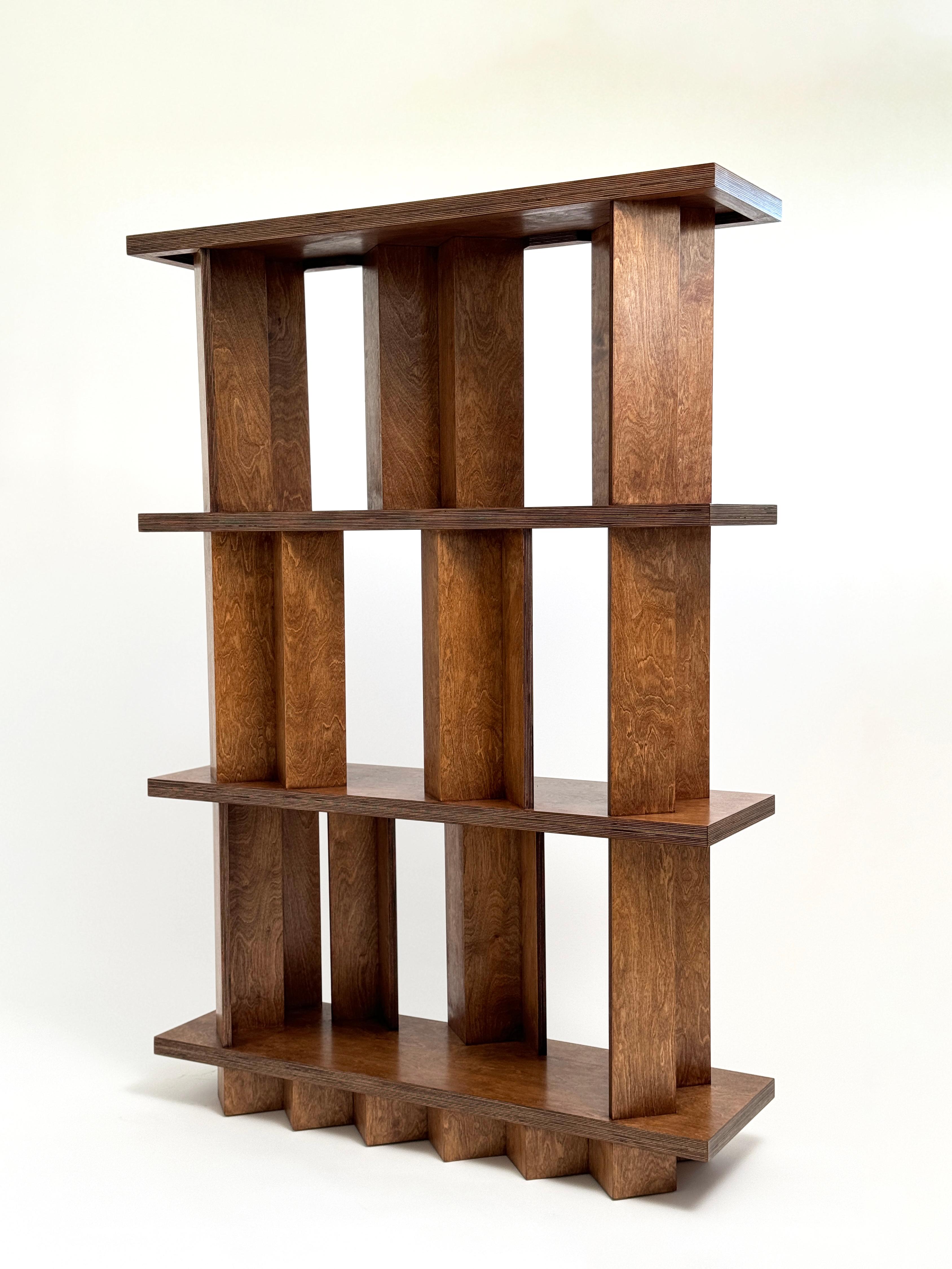 Foundation bookshelf by Goons 
Dimensions: W 74 x D 30 x H 150 cm
Materials: Birch plywood.
Oak finish.
Dimensions can be adjusted +/- 10 cm

Goons is located in Paris, France. All of their designs are made out of wood.