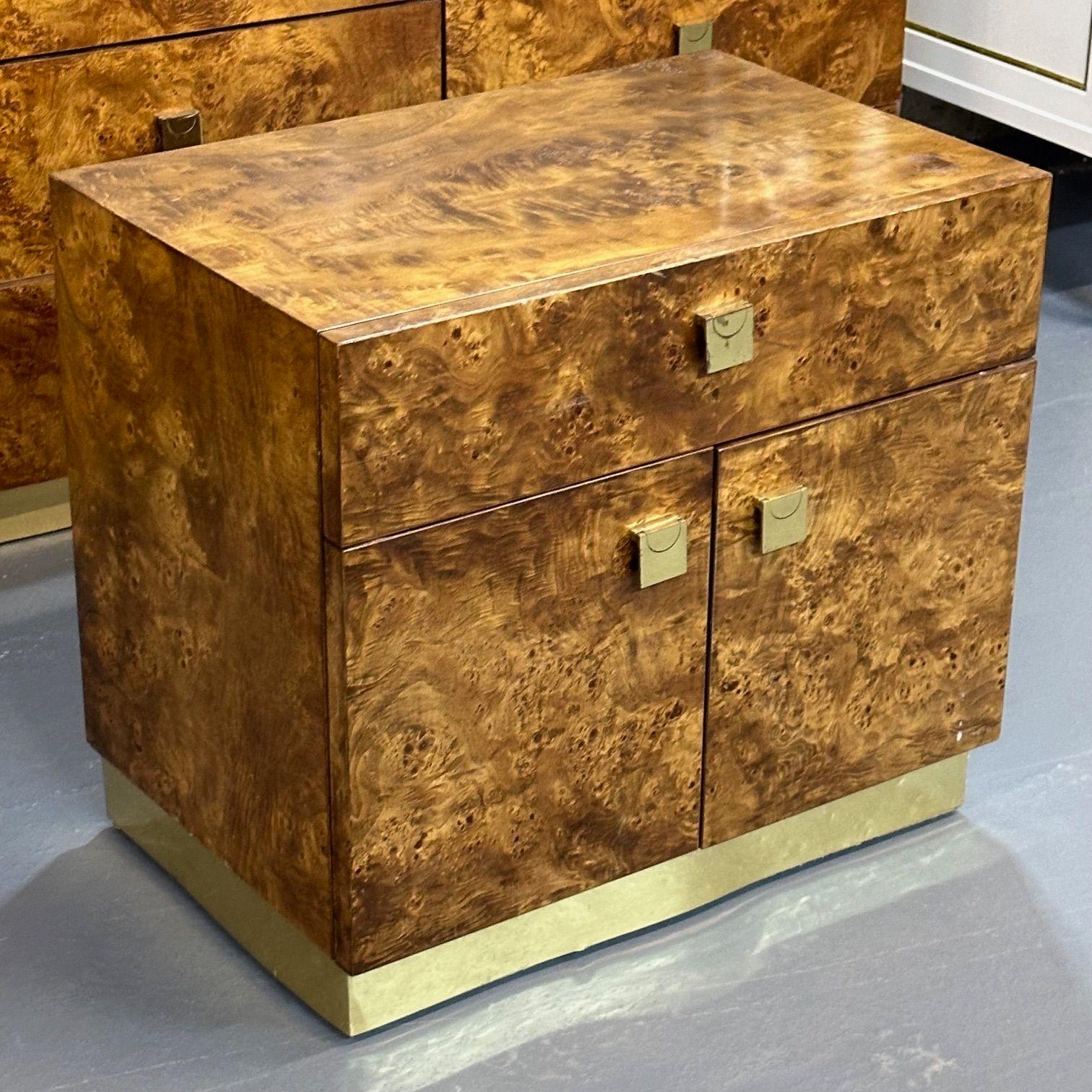 Founders, Mid-Century Modern, Nightstands, Burlwood, USA, 1970s

A nightstand with a single drawer over a storage compartment with two doors and nice hide-a-way handles. All rests on a chicly inset brass base. A matching dresser is available as well