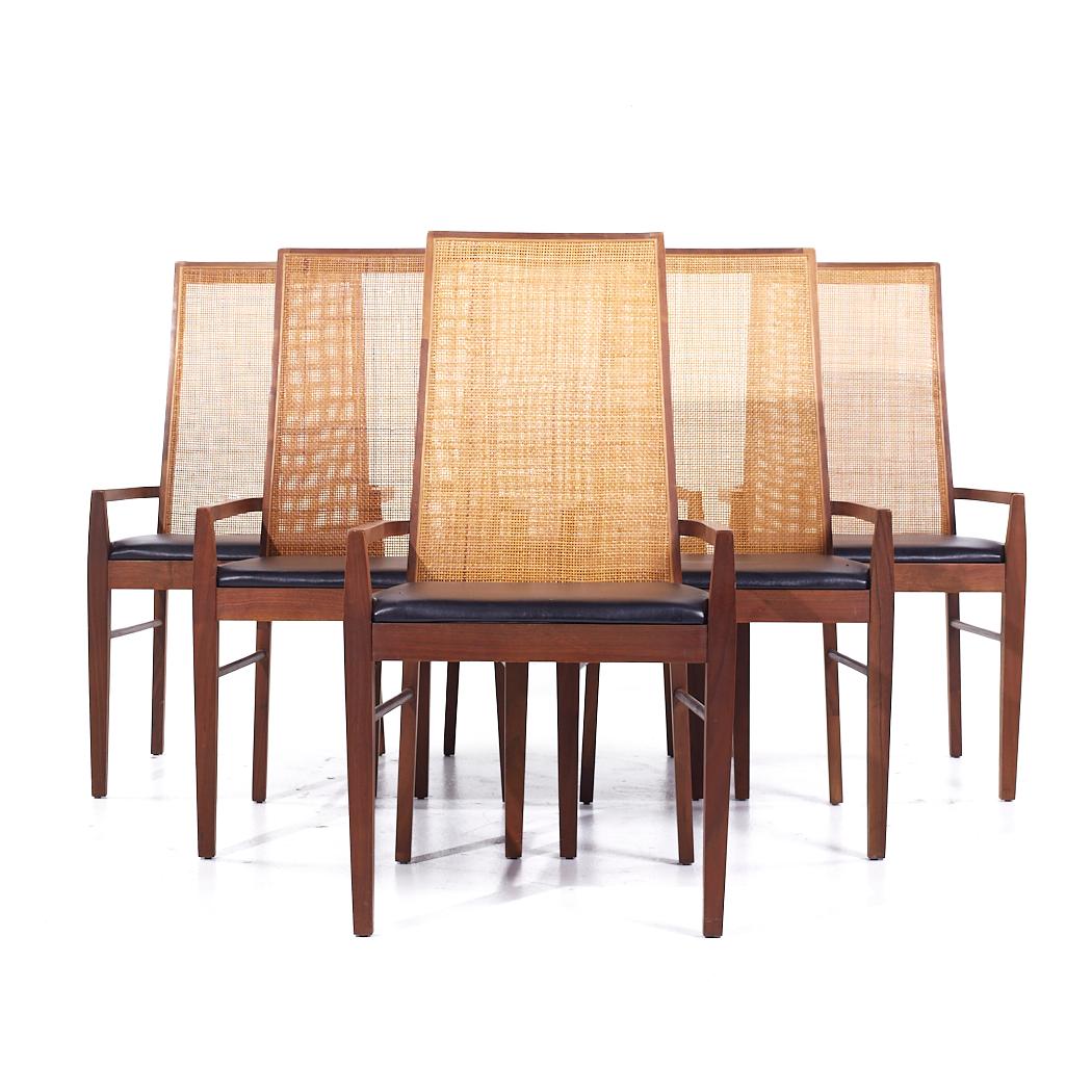 Founders Mid Century Walnut and Cane Dining Chairs - Set of 6

Each chair measures: 20.5 wide x 21.75 deep x 38 inches high, with a seat height of 17.5 and arm height/chair clearance of 21.25 inches

All pieces of furniture can be had in what we