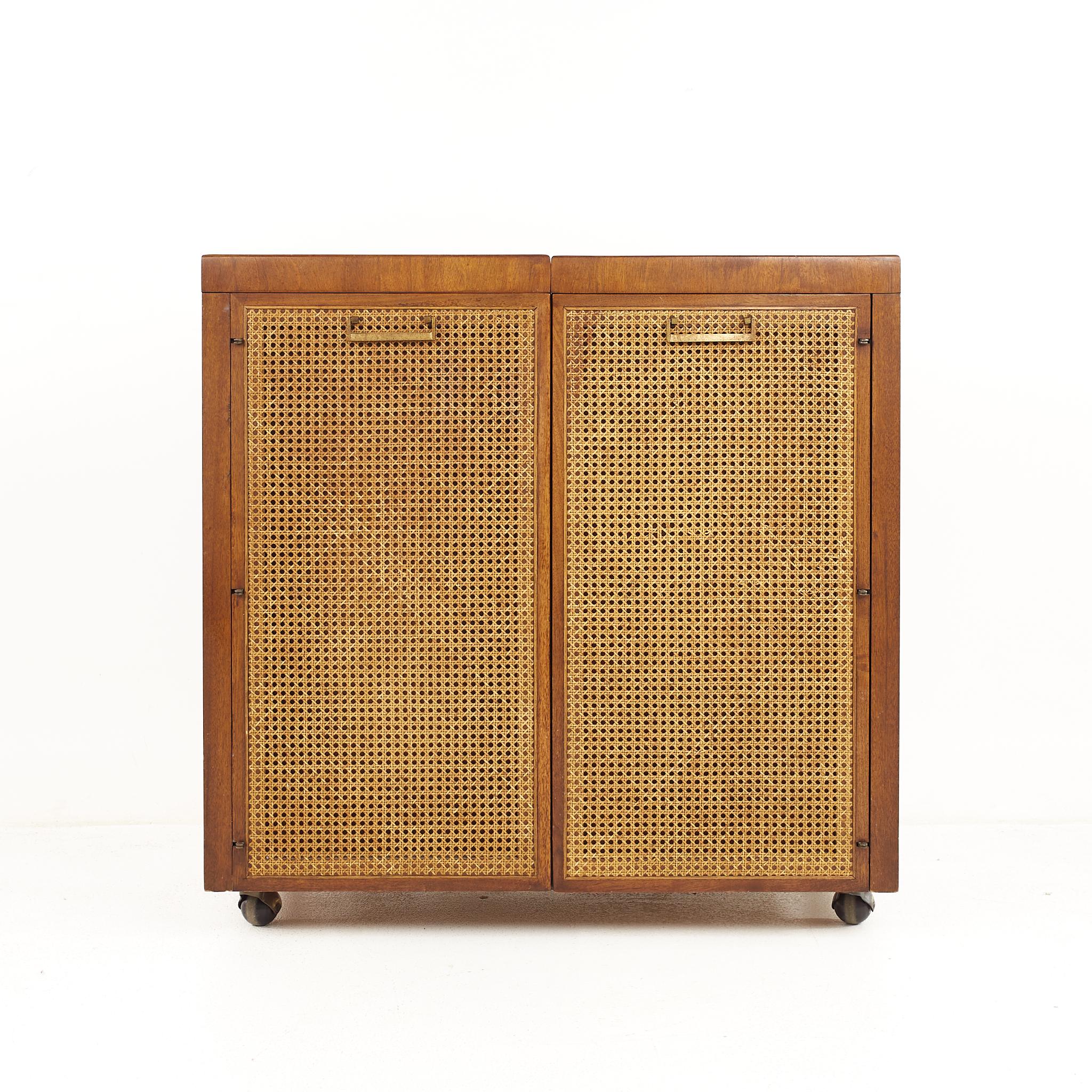 Founders mid century walnut and cane front bar cabinet

The bar cart measures: 36.25 wide x 18.25 deep x 35.50 inches high

All pieces of furniture can be had in what we call restored vintage condition. That means the piece is restored upon