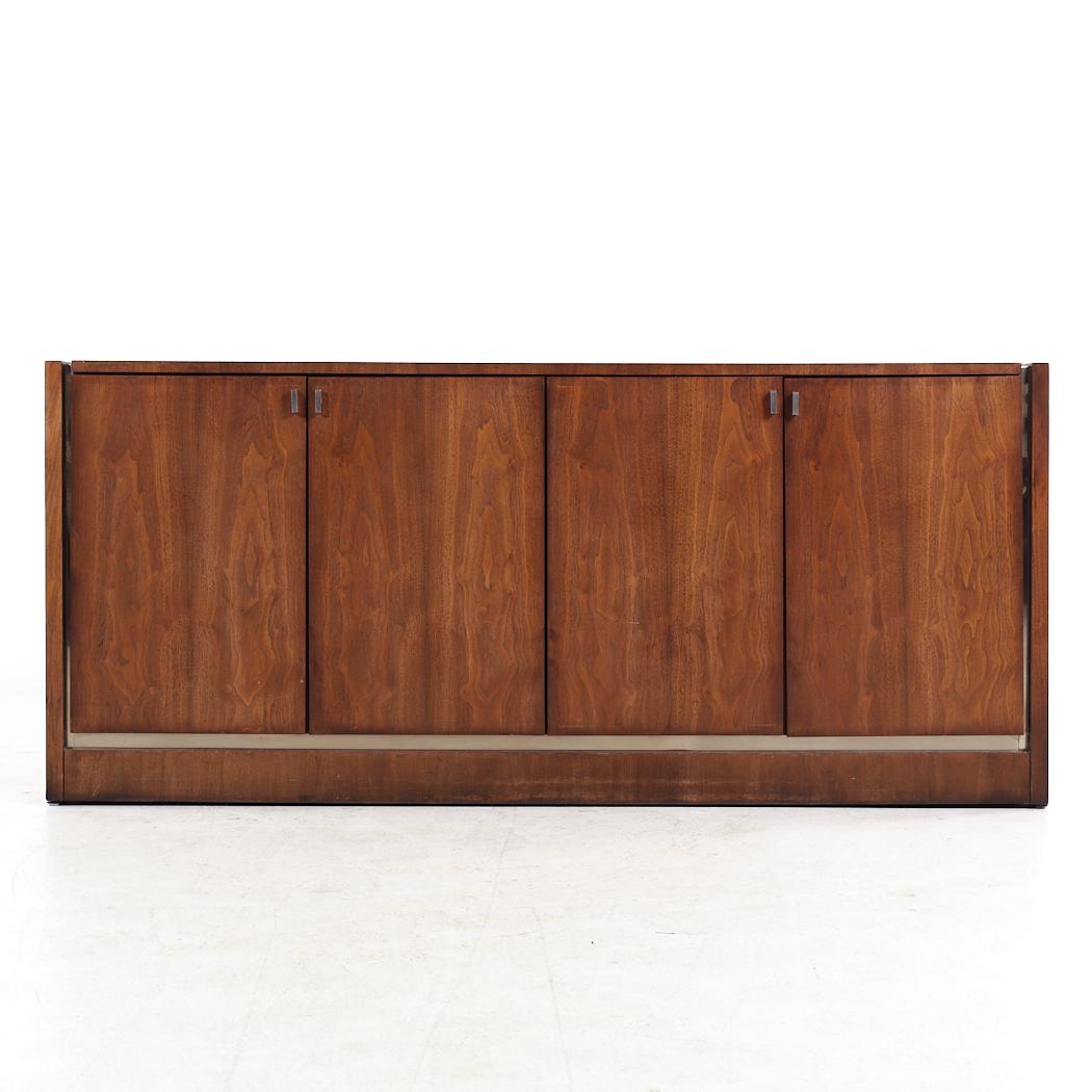 Founders Mid Century Walnut Credenza

This credenza measures: 68 wide x 19 deep x 30.25 inches high

All pieces of furniture can be had in what we call restored vintage condition. That means the piece is restored upon purchase so it’s free of
