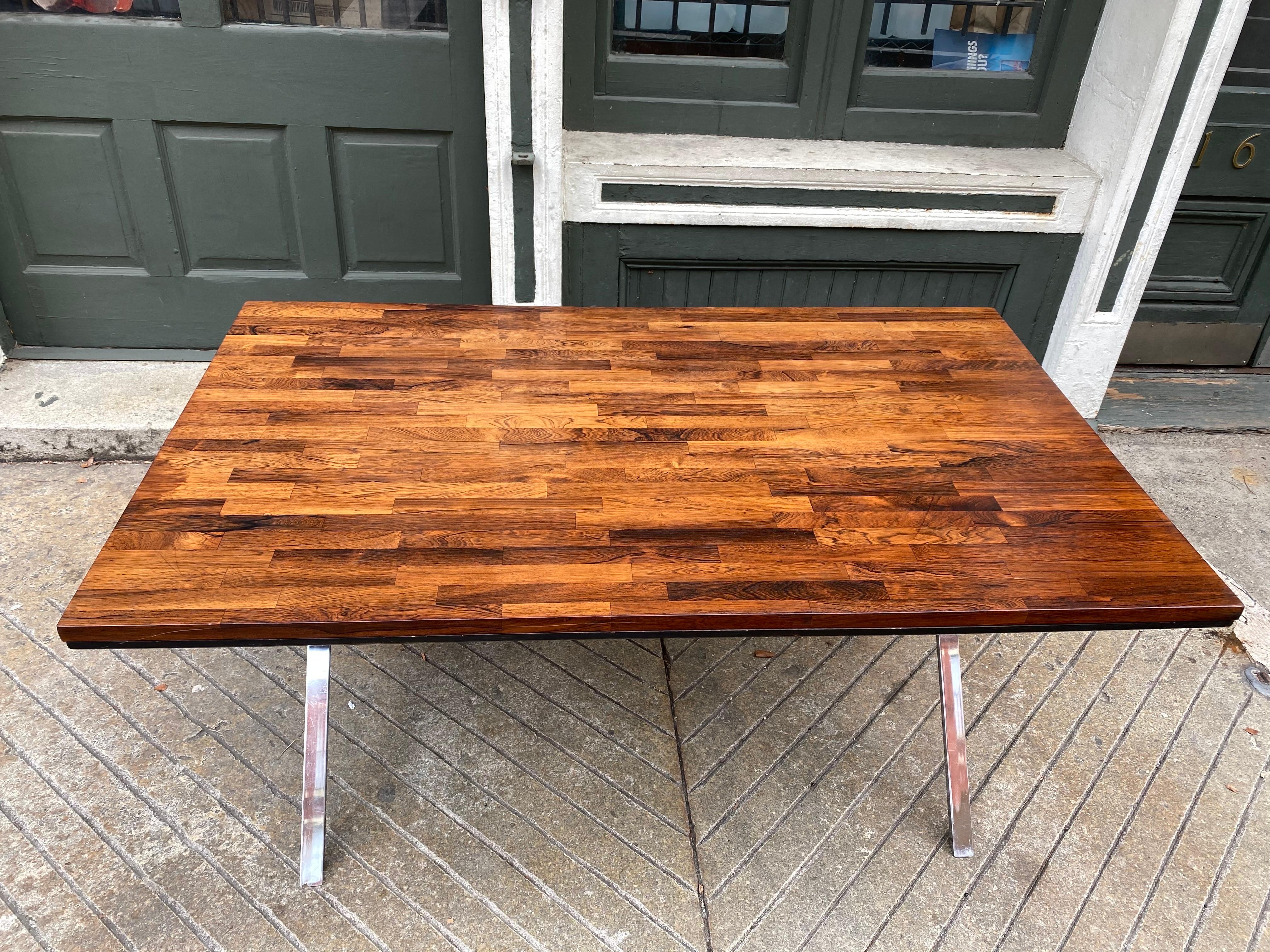 Founders solid rosewood table with chrome X-base. Solid blocks of rosewood forms the top much like a butcher block table is produced. Often attributed to Milo Baughman, because of the chrome base. Great size to use for dining table, desk or small