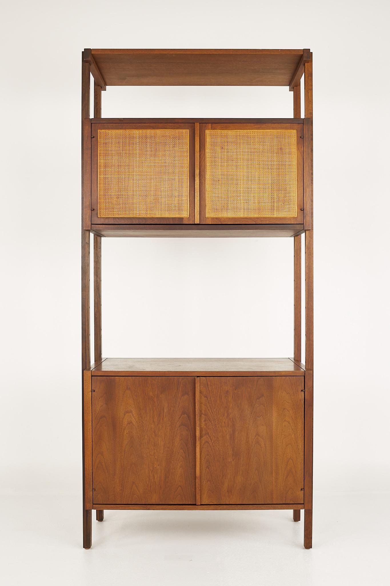 Founders style mid century walnut cane front freestanding wall unit section bookcase

This bookcase measures: 33.75 wide x 16 deep x 73 inches high

?All pieces of furniture can be had in what we call restored vintage condition. That means the