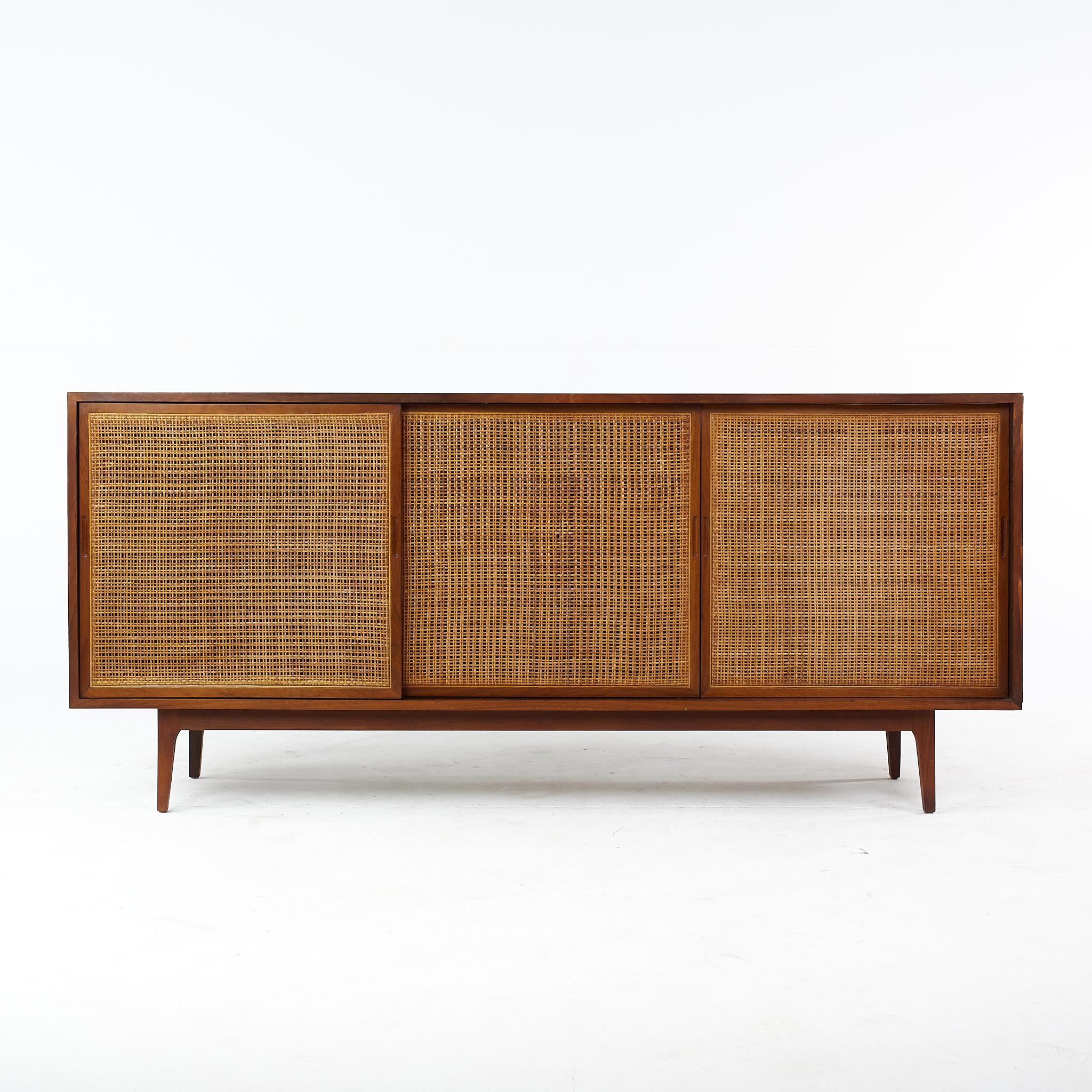 Founders Stylemid century walnut and cane front credenza

This credenza measures: 71.75 wide x 18 deep x 32 inches high

All pieces of furniture can be had in what we call restored vintage condition. That means the piece is restored upon