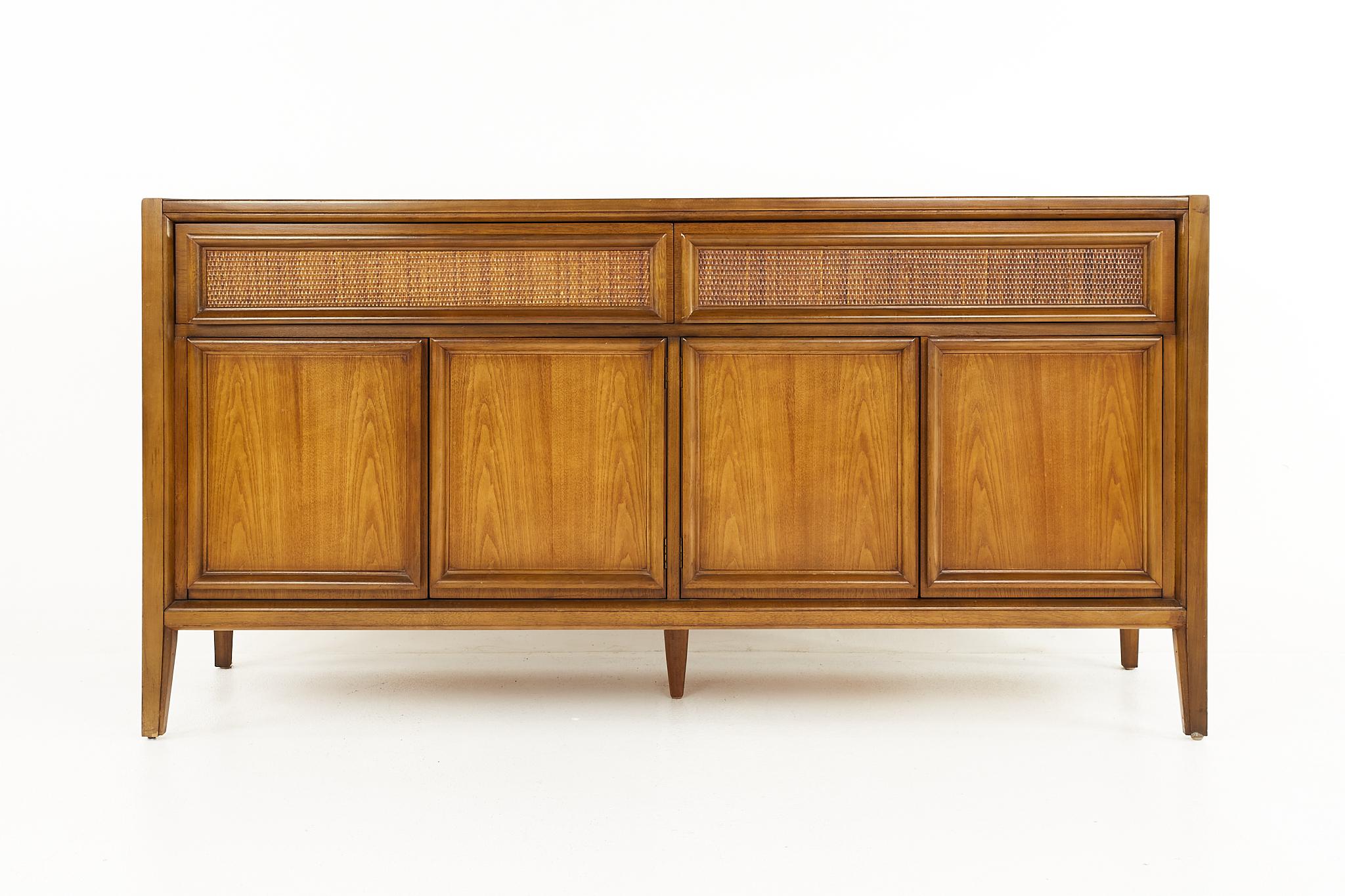 Founders style mid century walnut basket woven front credenza buffet

The credenza measures: 62 wide x 19 deep x 31.75 inches high

All pieces of furniture can be had in what we call restored vintage condition. That means the piece is restored