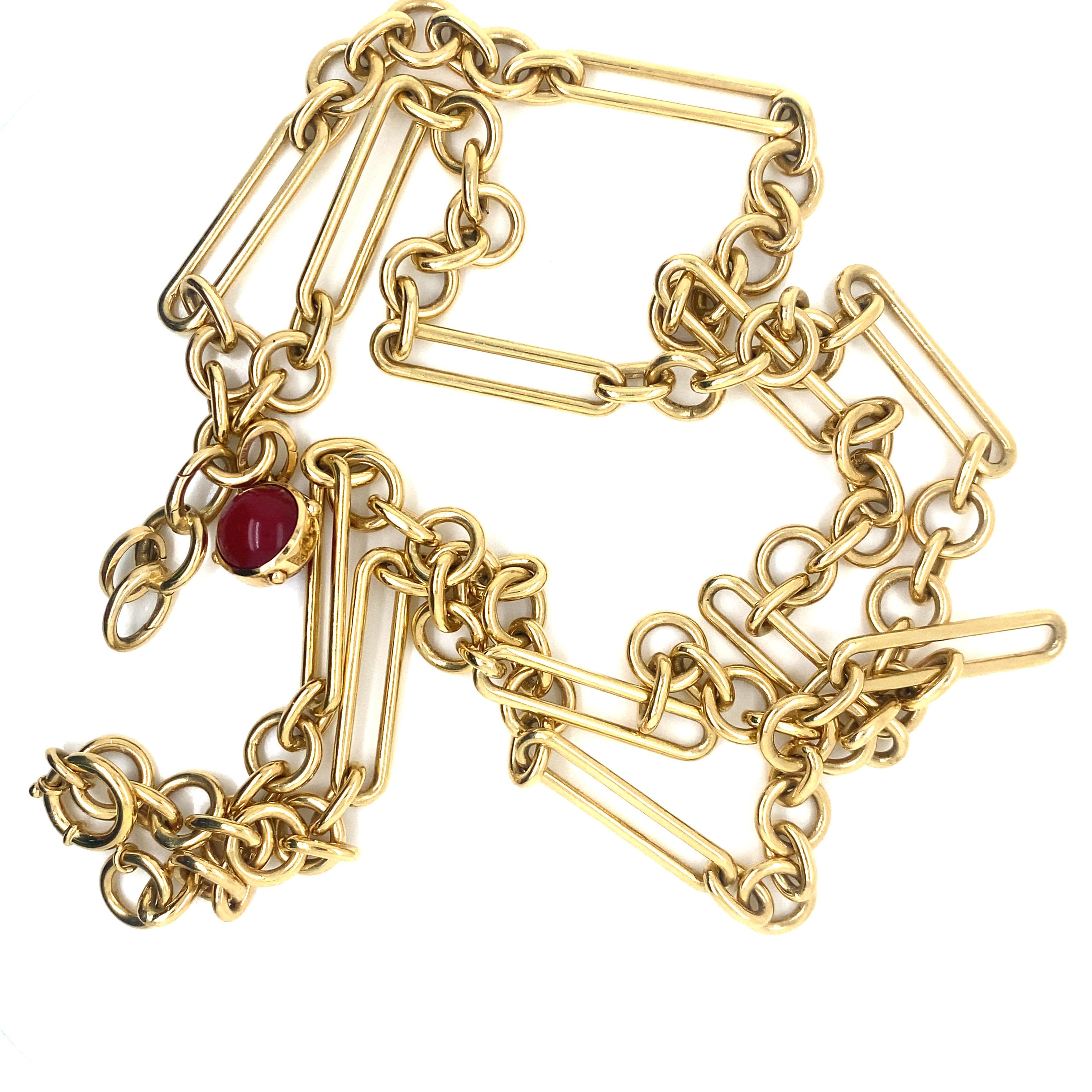 Foundrae Chain Link Necklace in 18K Yellow Gold.  The Necklace measures 36 inch in length. 126.28 grams. Signed. Includes Signed Ruby Charm.  Necklace Only.  Retails $21,585