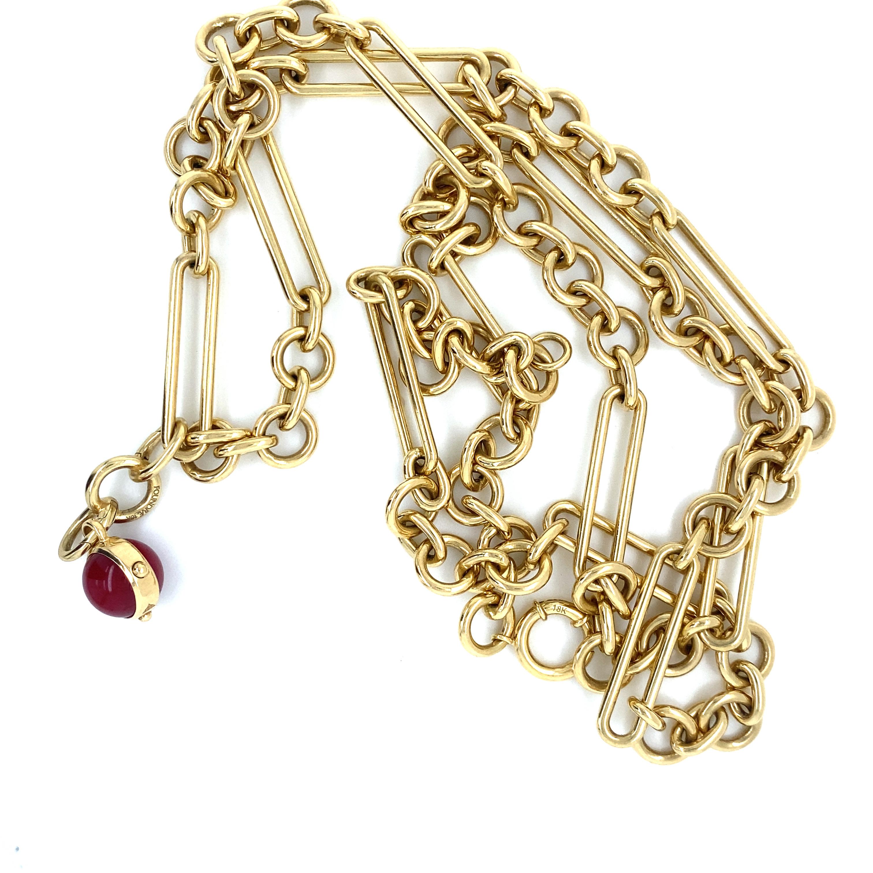 Foundrae Chain Link Necklace in 18K Yellow Gold.  The Necklace measures 32 inch in length. 104.66 grams. Signed. Includes Signed Ruby Charm.  Necklace Only.  Retails $21,585