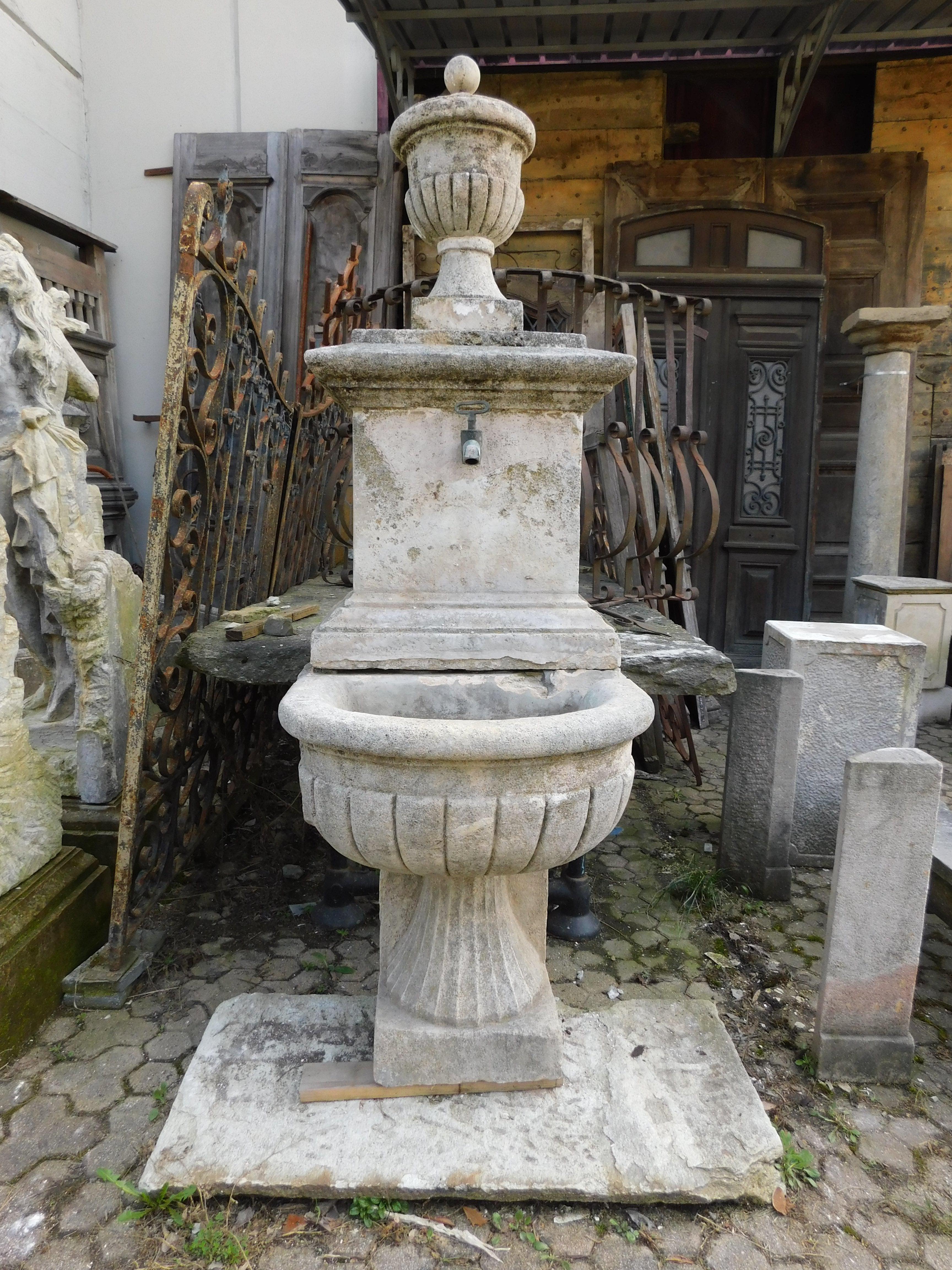 Ancient and important wall fountain, richly carved in gray stone, with iron filler, ashlar basin and wall pillar, built for a garden in Italy, in the 19th century, from southern Italy, measures cm w 66 x H 215 (127 H only washbasin) x d 85 maximum
