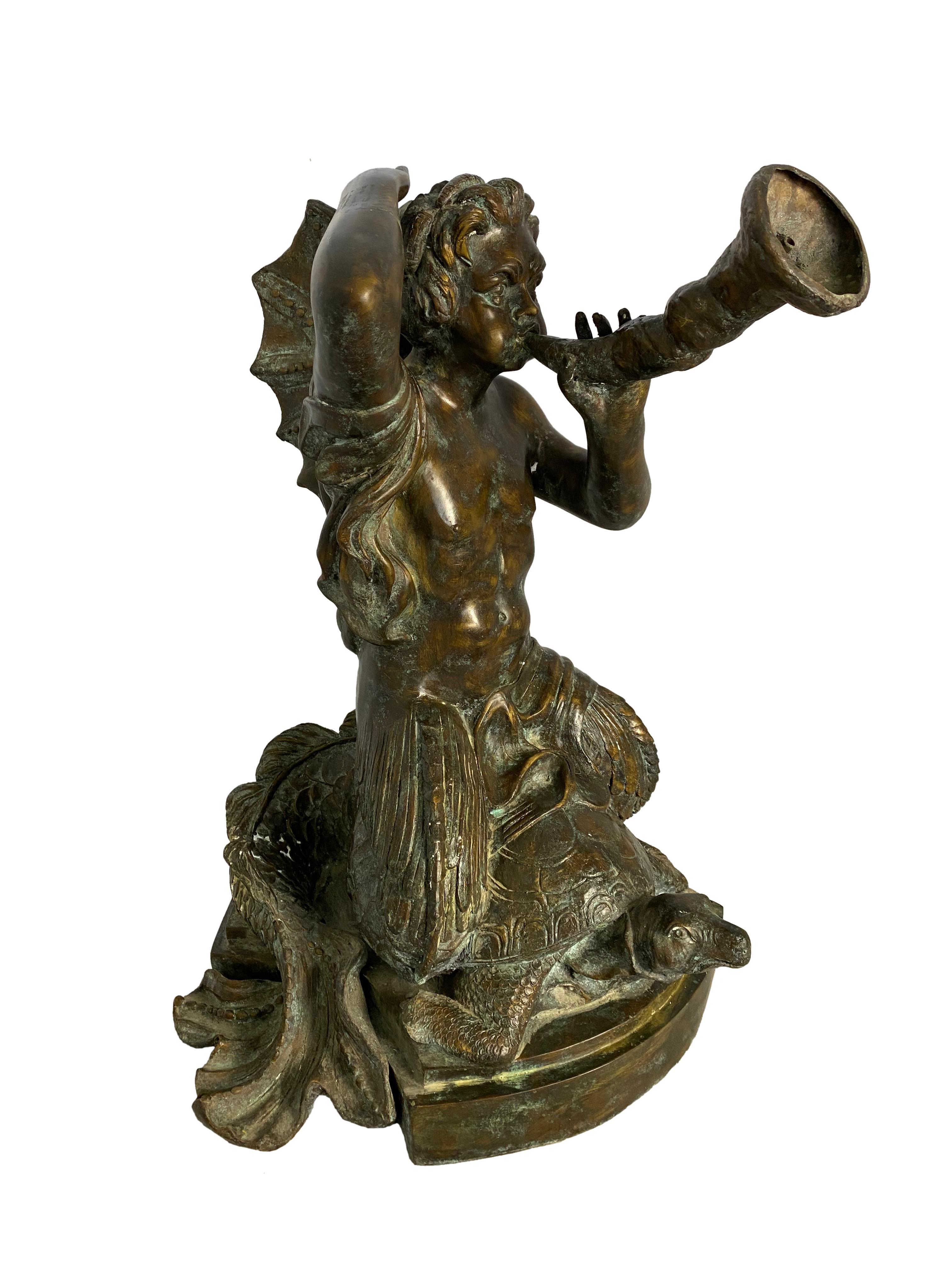A fantastically detailed bronze mermaid woman seated upon a large tortoise. She appears to be playing a musical instrument, such as a horn, which acts as a fountain and can be viewed in more detail within the images attached. 

Dimensions (cm):
H